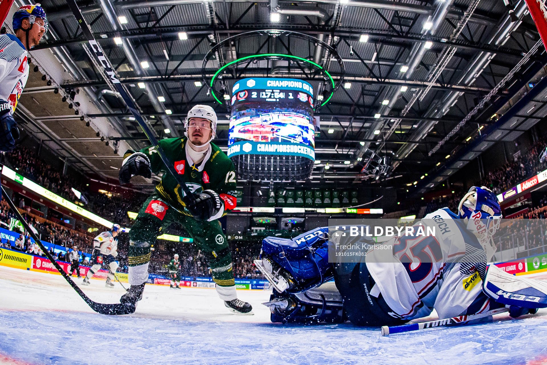 Ville Leskinen of Färjestad and goalkeeper Kevin Reich  of