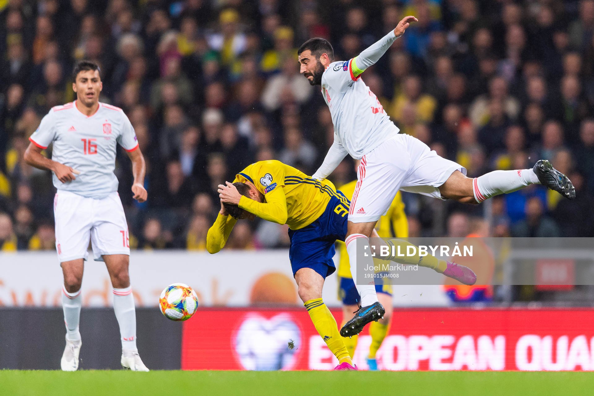 Marcus Berg of Sweden competes for the ball with Raul Albiol