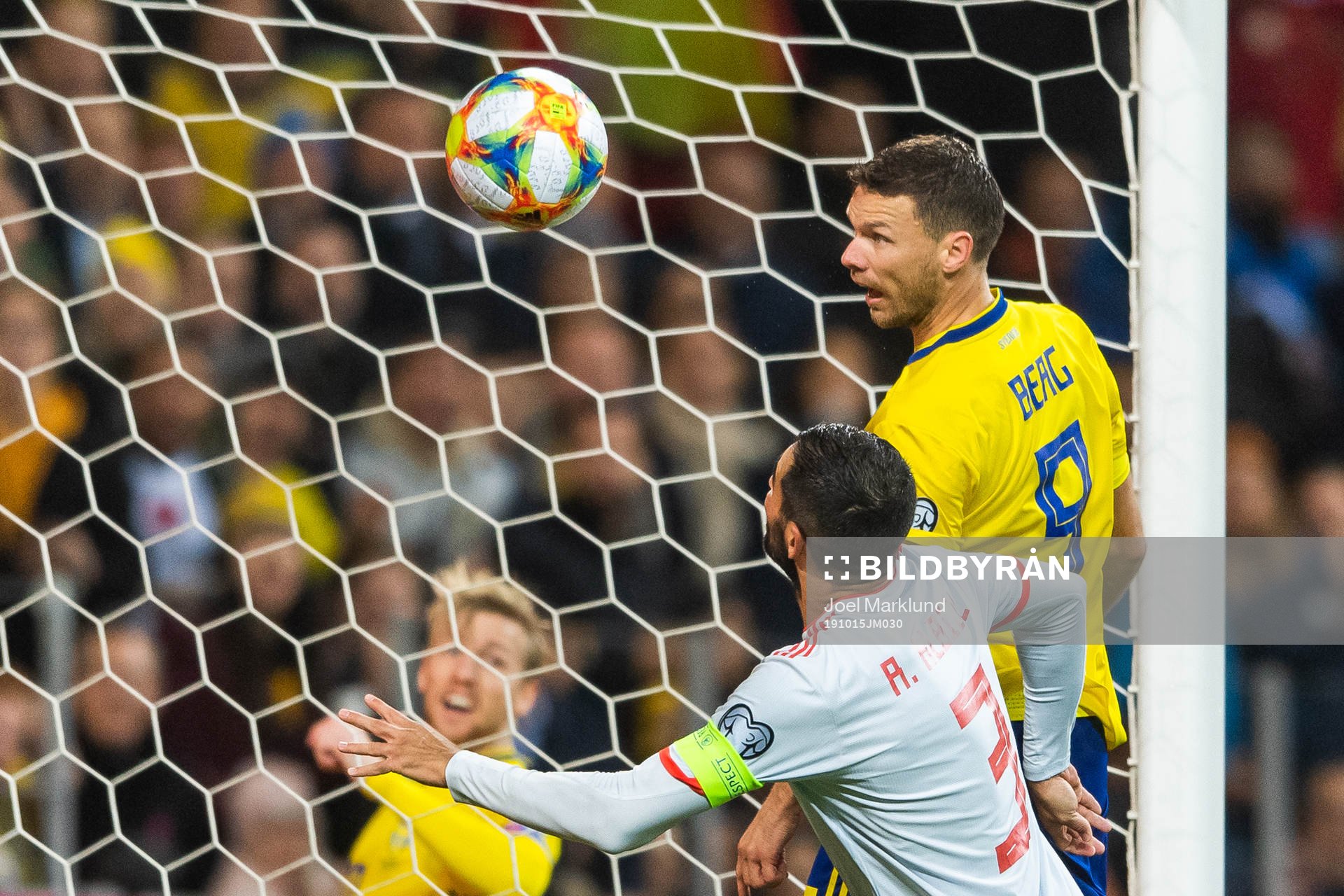 Marcus Berg of Sweden scores 1-0 in competition with Raul