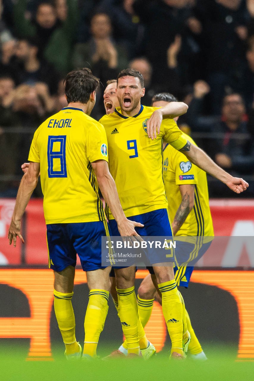 Albin Ekdal, Marcus Berg and Sebastian Larsson of Sweden celebrate after Berg scored 1-0 during the UEFA Euro Qualifier football match between Sweden and Spain on October 15, 2019 in Stockholm.