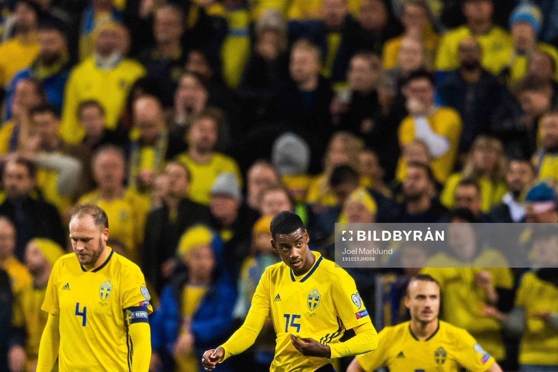 Andreas Granqvist and Alexander Isak look dejected