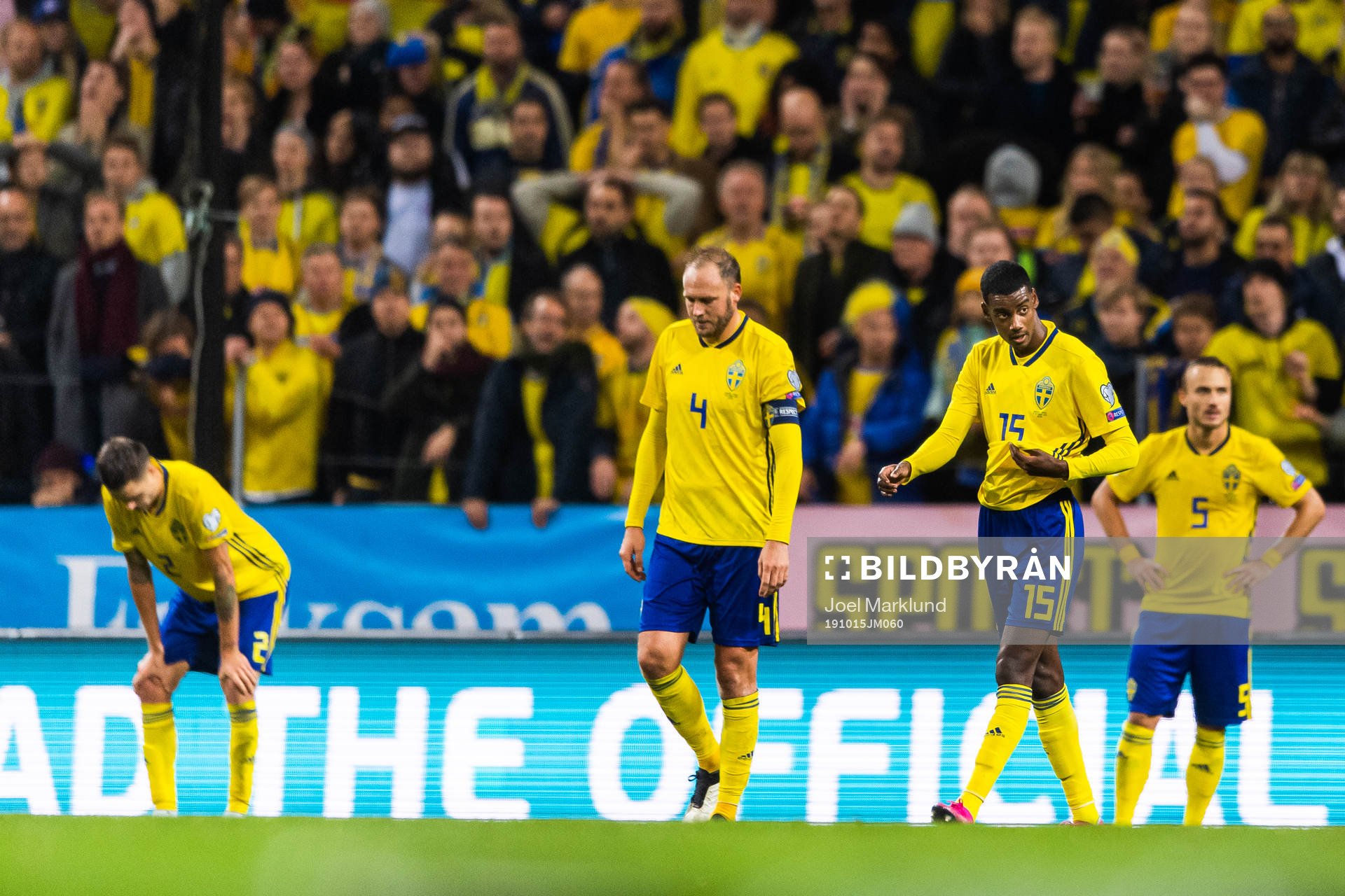 Andreas Granqvist and Alexander Isak look dejected