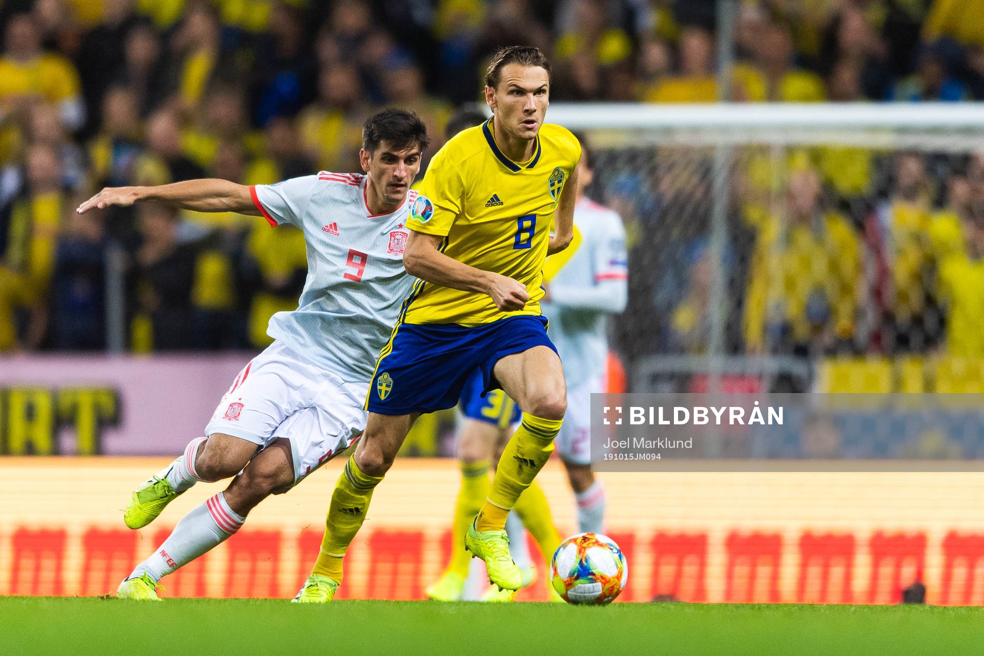 Gerard Moreno of Spain and Albin Ekdal of Sweden