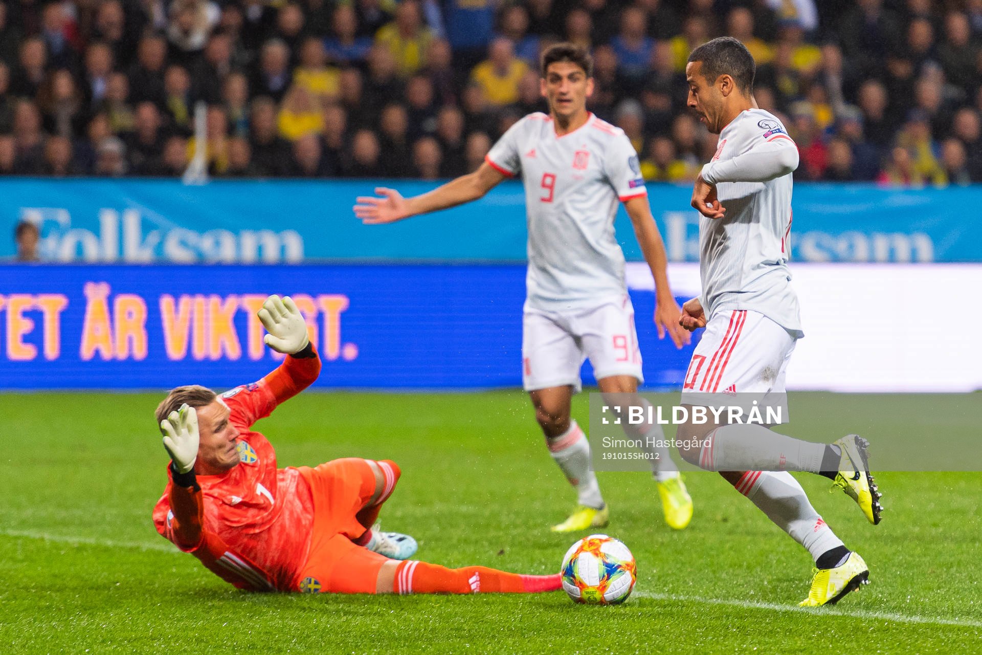 Goalkeeper Robin Olsen of Sweden saves a chance from Thiago