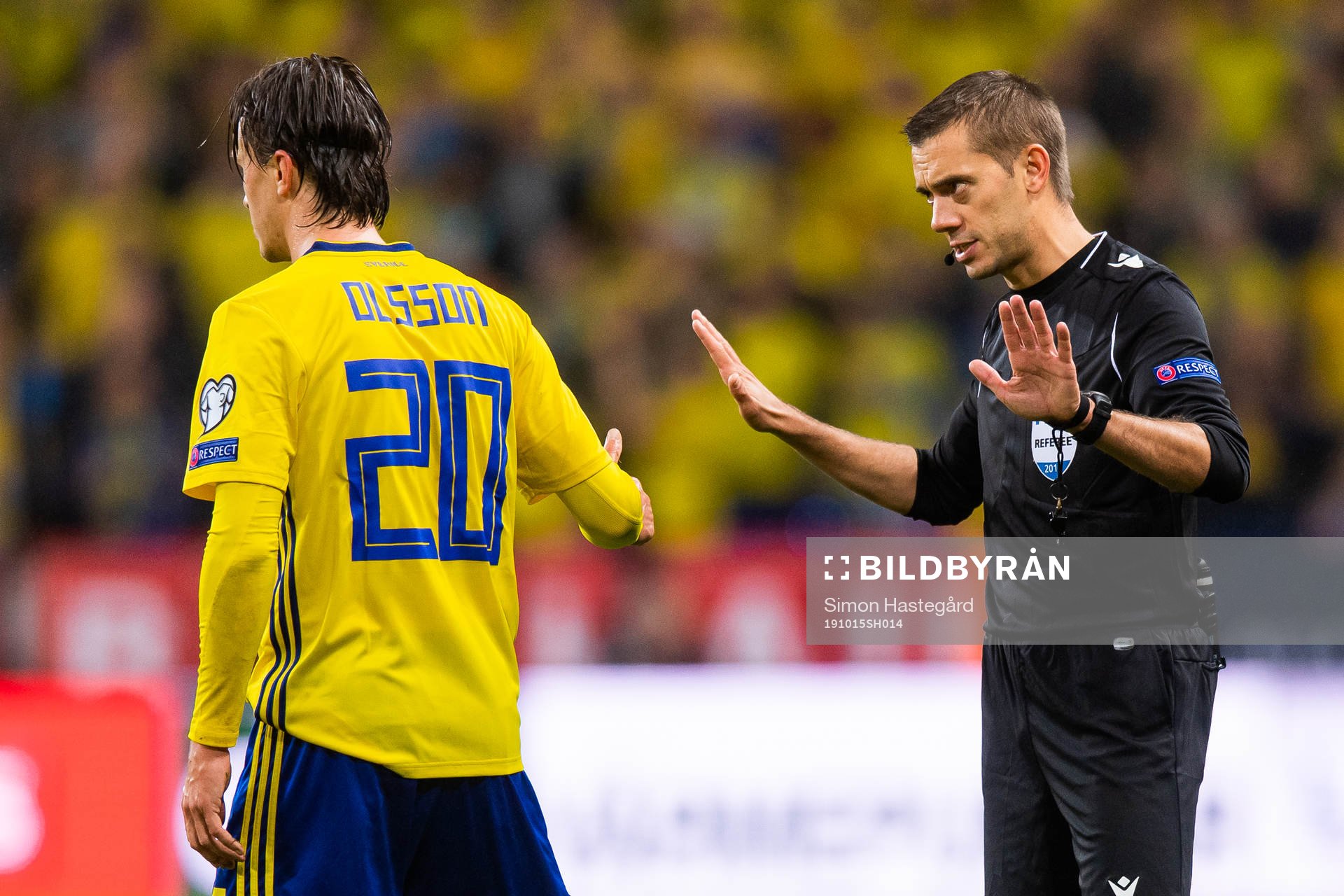 Kristoffer Olsson of Sweden in a discussion with referee