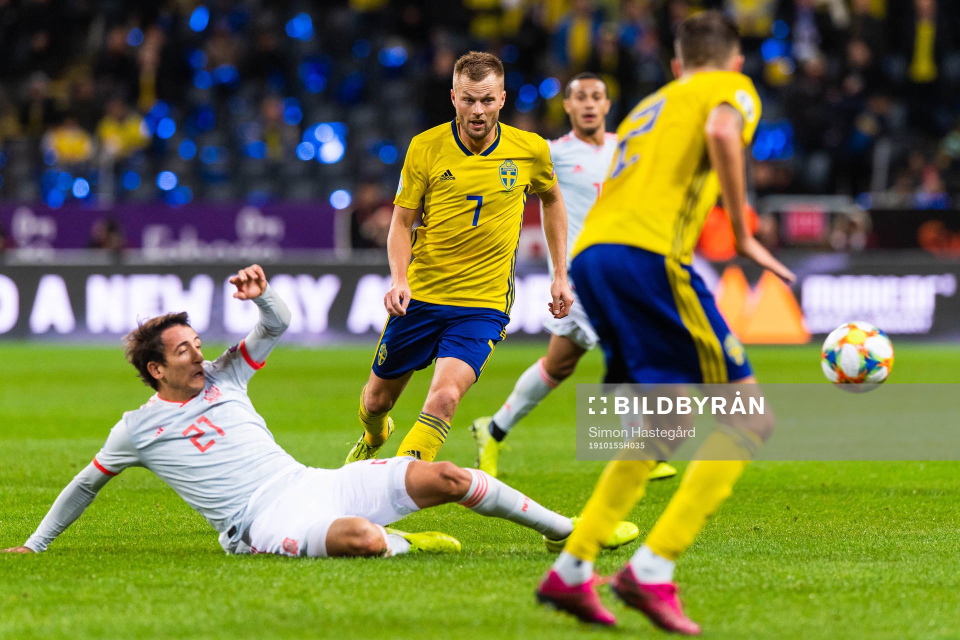 Mikel Oyarzabal of Spain tackles Sebastian Larsson of Sweden