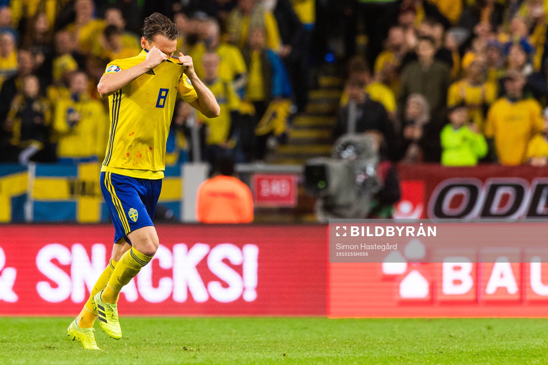 Albin Ekdal of Sweden goes off to change his shirt because