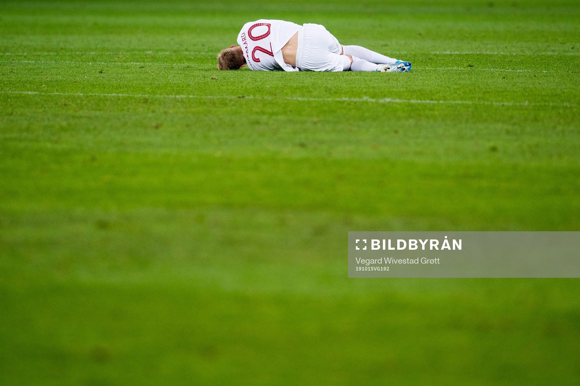 Martin Ødegaard of Norway lies down with an injury
