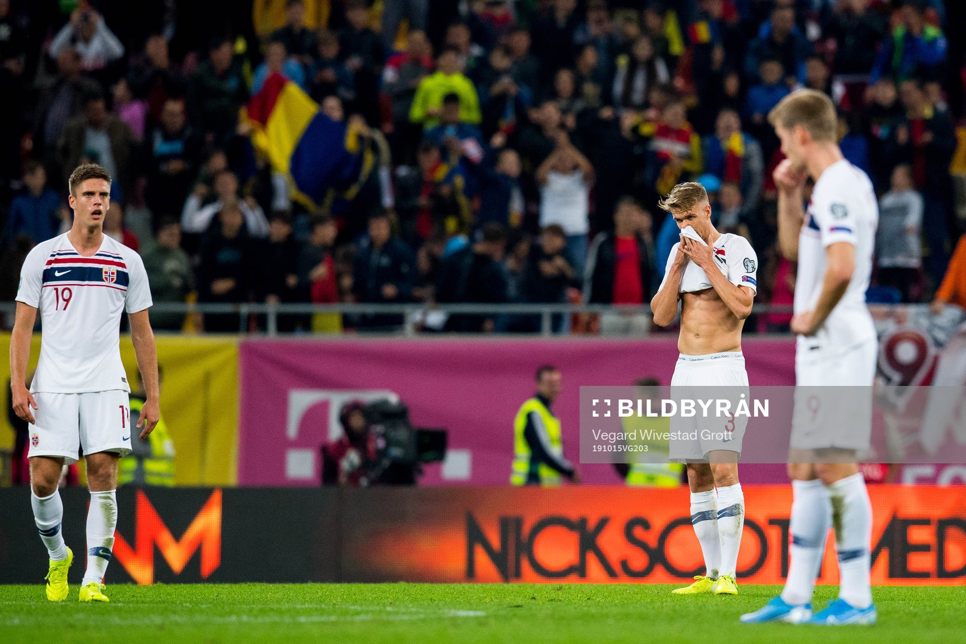 Markus Henriksen and Kristoffer Ajer of Norway look dejected
