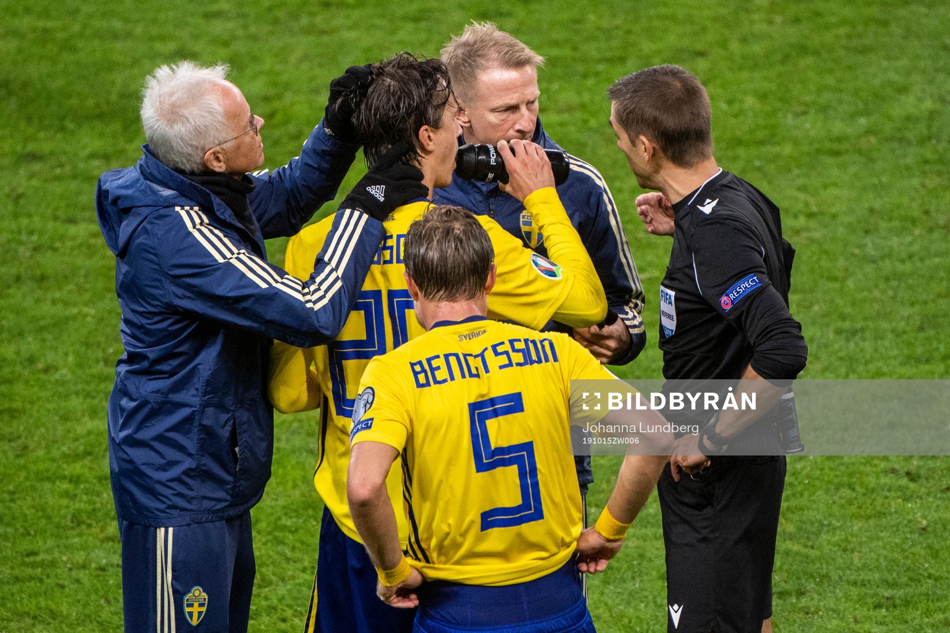 Kristoffer Olsson of Sweden receives medical attention
