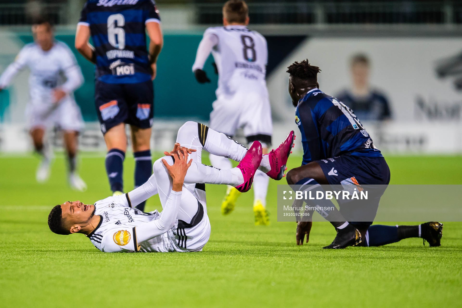 Bjørn Maars Johnsen of Rosenborg in pain and Aliou Coly of