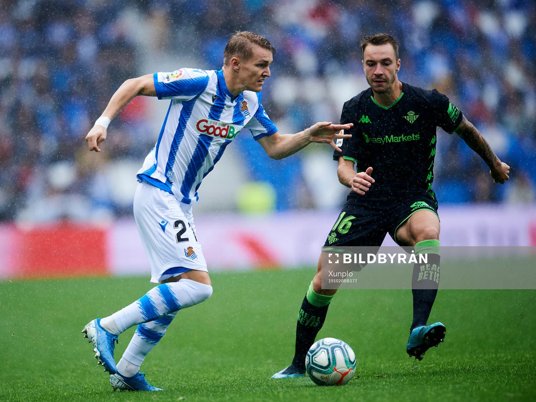 Martin Odegaard of Real Sociedad battles for the ball with