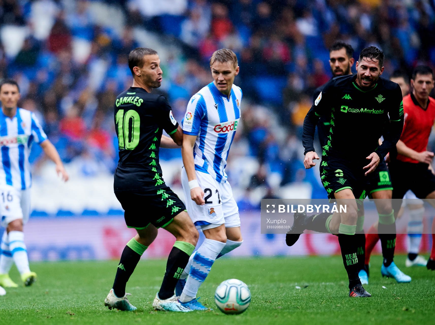 Martin Odegaard of Real Sociedad battles for the ball with