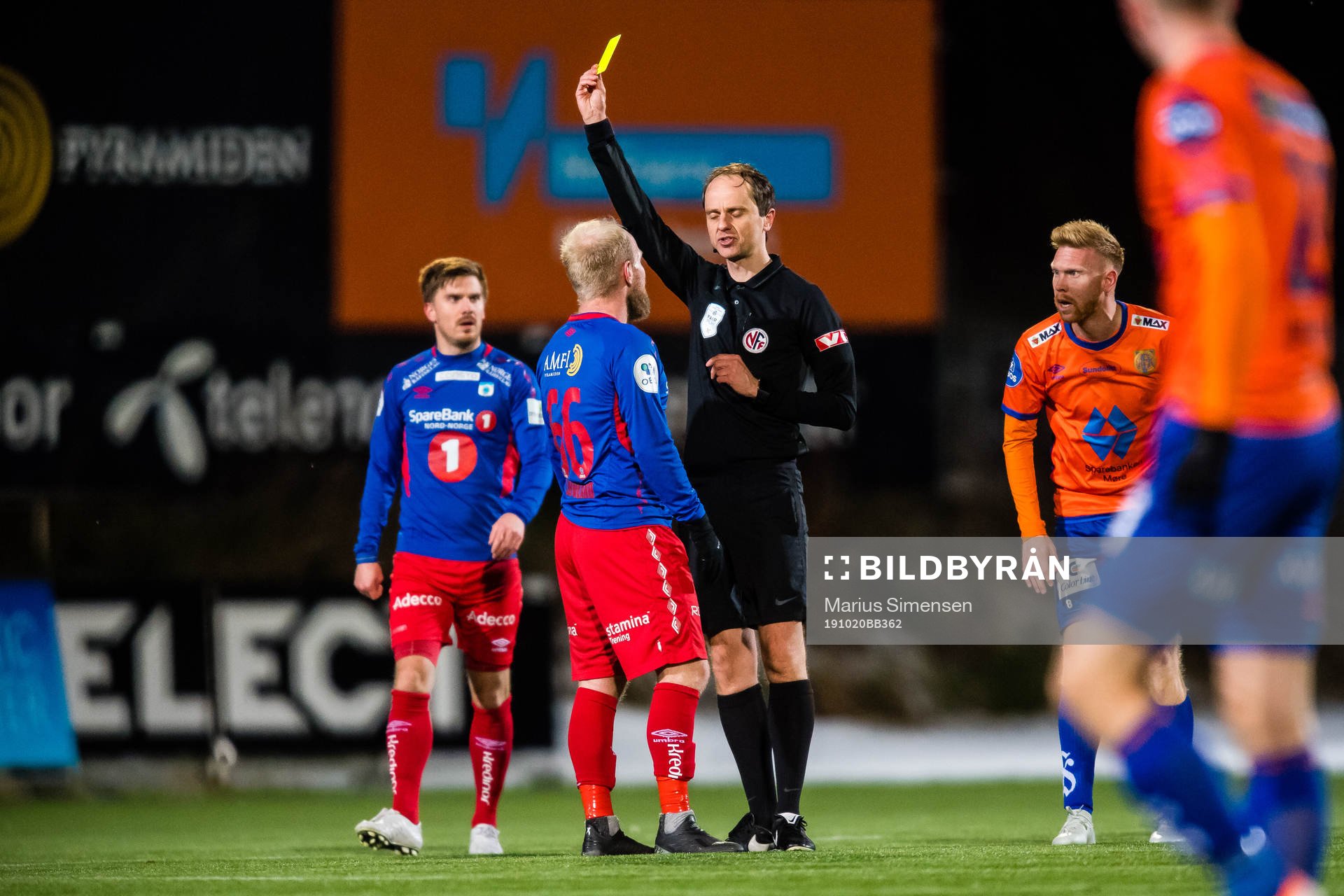 Andreas Løvland of Tromsdalen gets a yellow card by Jan Morten Tennøy, referee, during the OBOS-ligaen match between Tromsdalen and Aalesund on October 20, 2019 in Tromsø.
