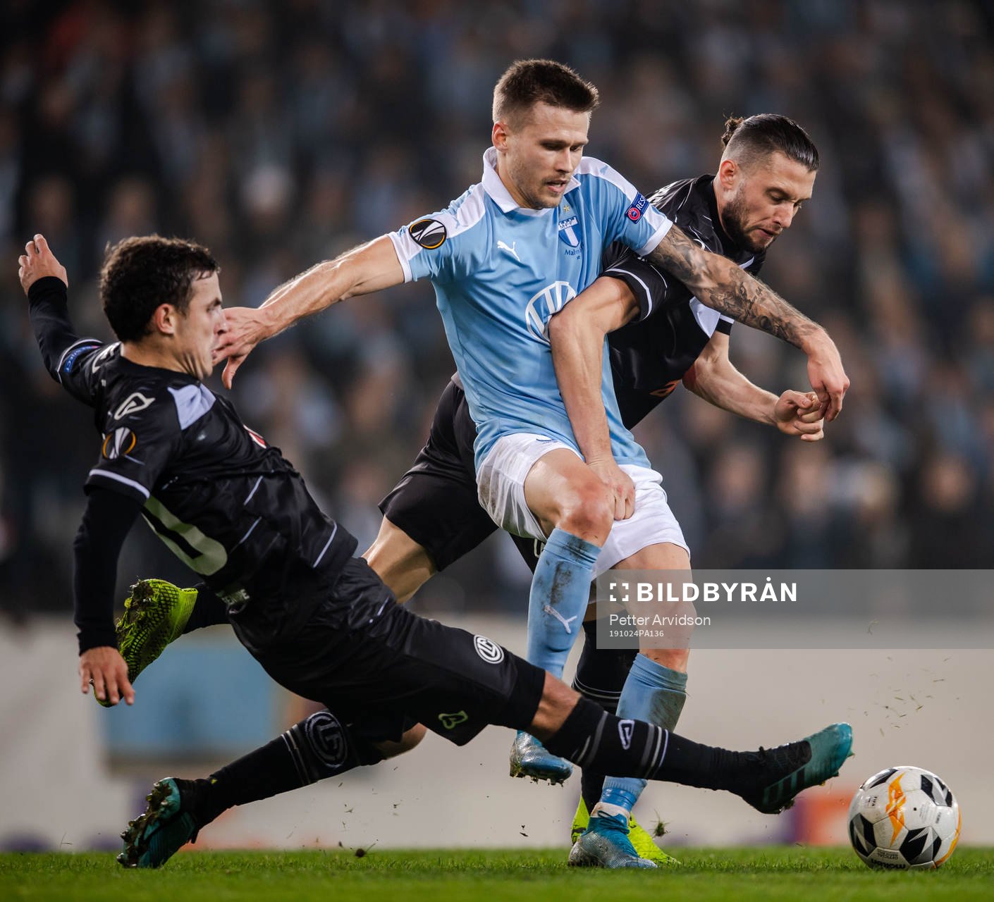 Arnor Traustason of Malmö FF against Olivier Custodio and