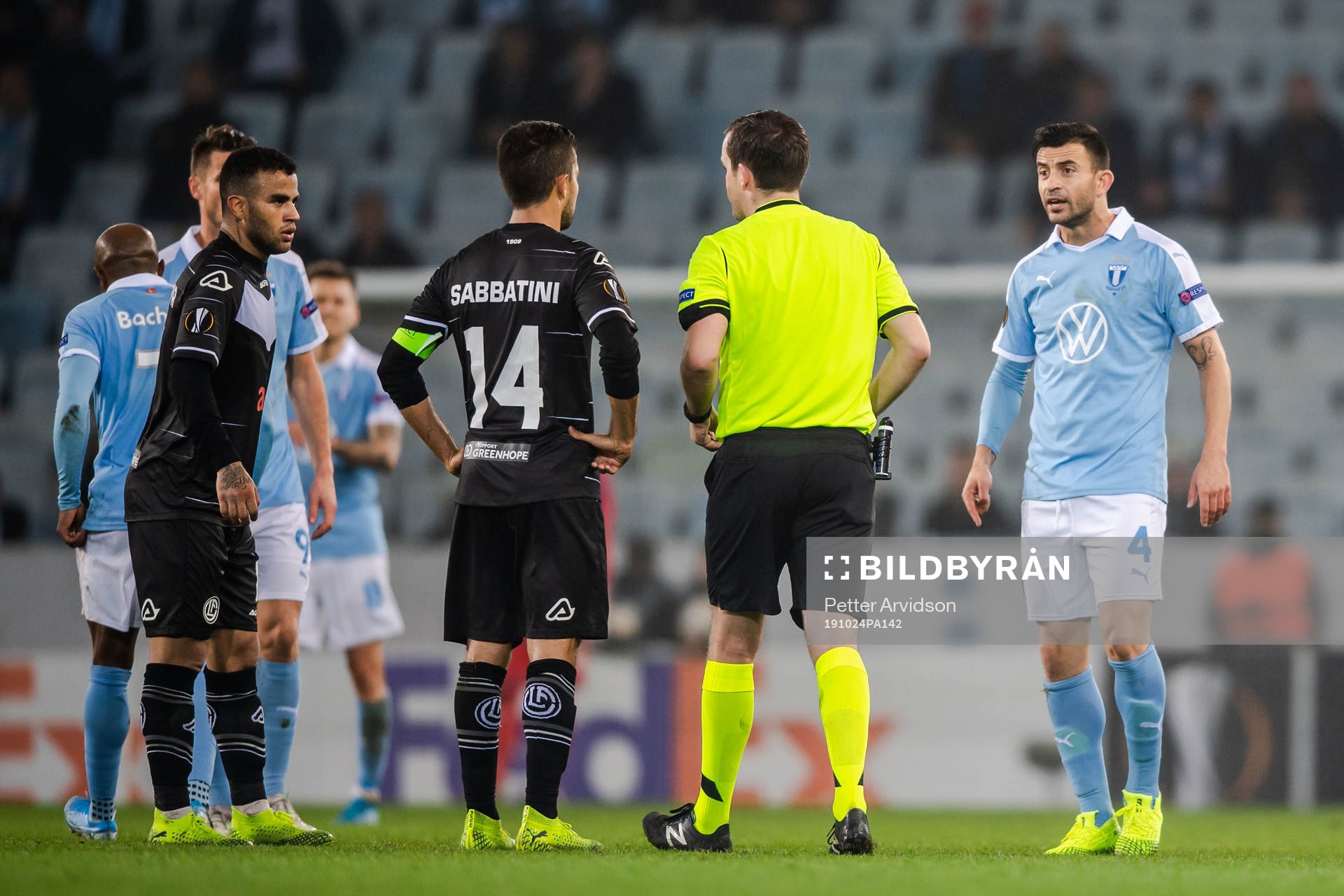 Behrang Safari of Malmö FF receives a varning from referee