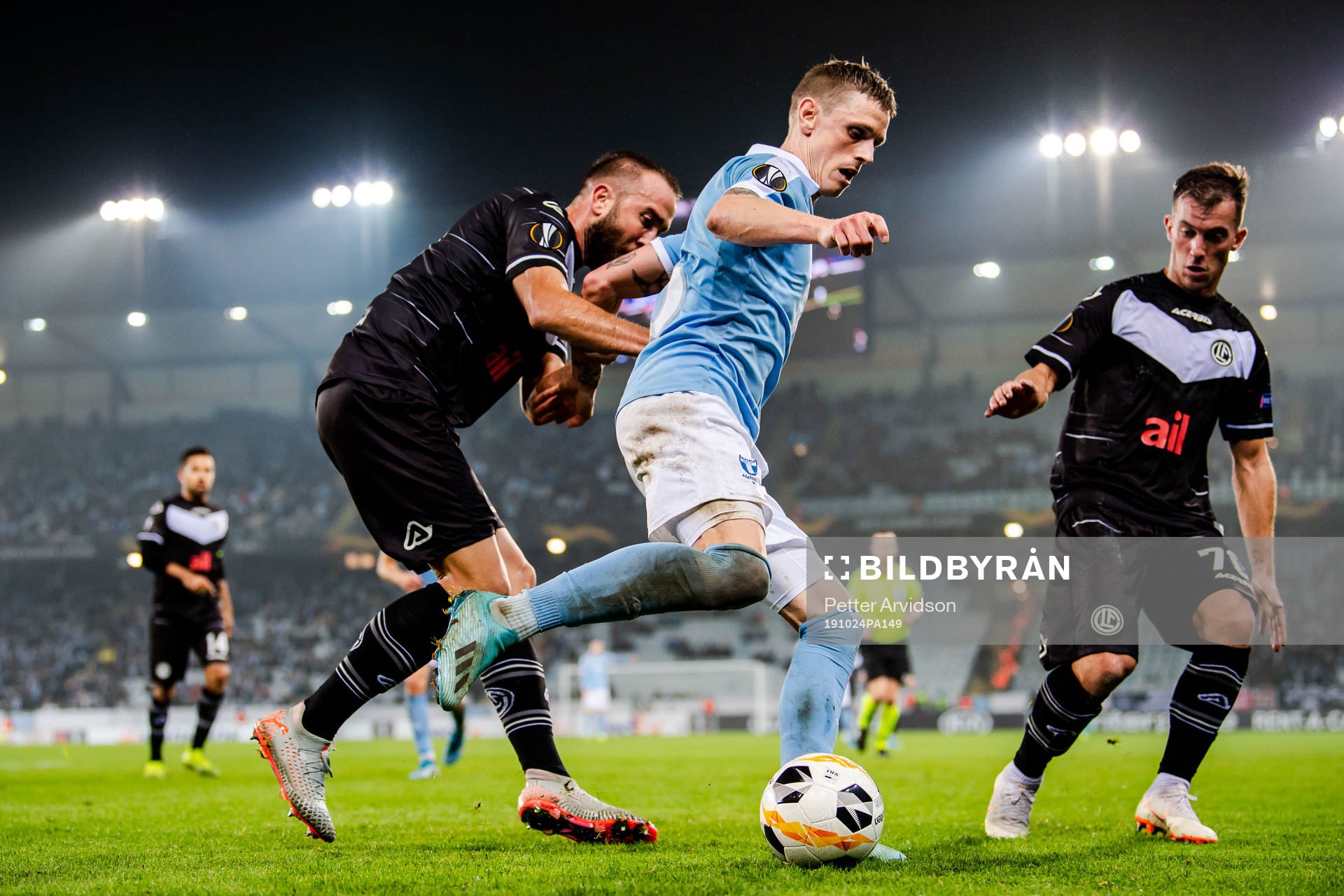 Sören Rieks of Malmö FF against Mijat Maric and Marco