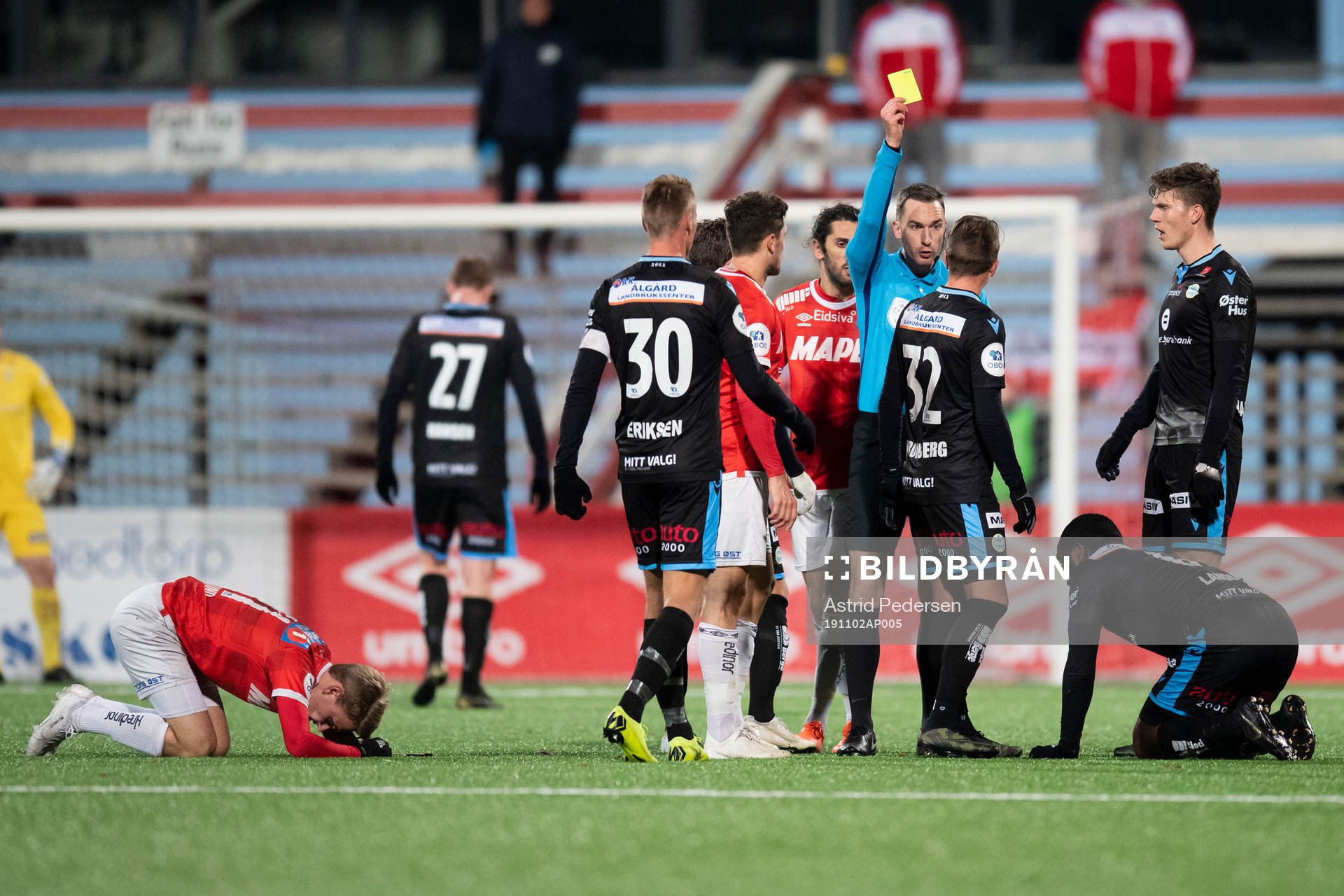 Claes Kronberg of Sandnes Ulf gets a yellow card by Marius