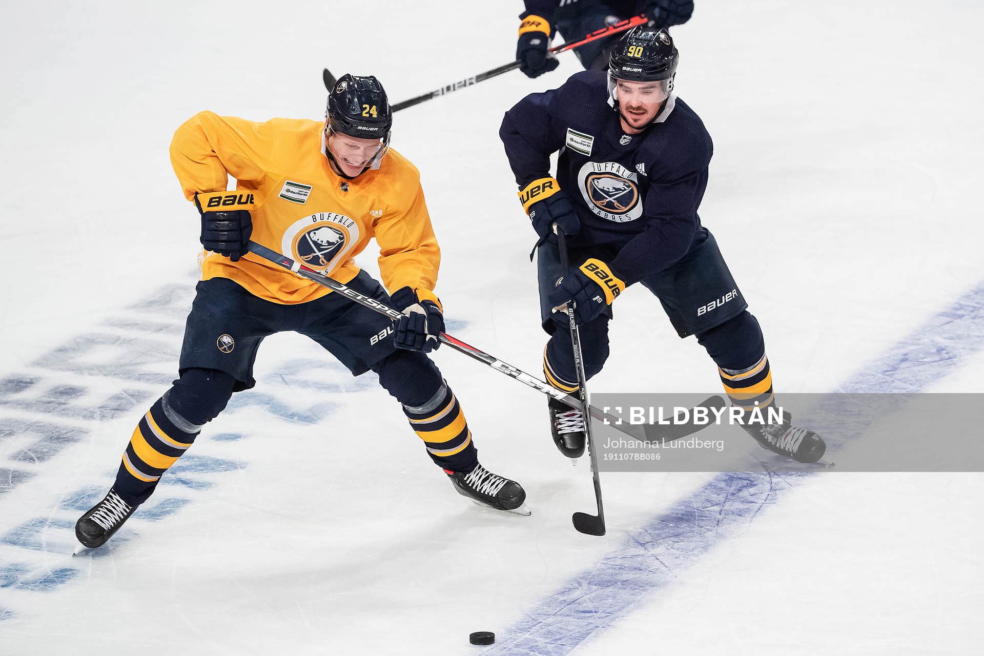 Lawrence Pilut and Marcus Johansson of Buffalo Sabres