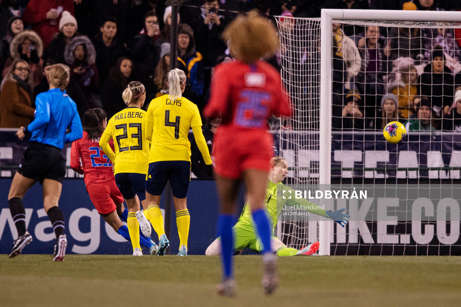 Christen Press of USA scores 2-0 behind goalkeeper Hedvig