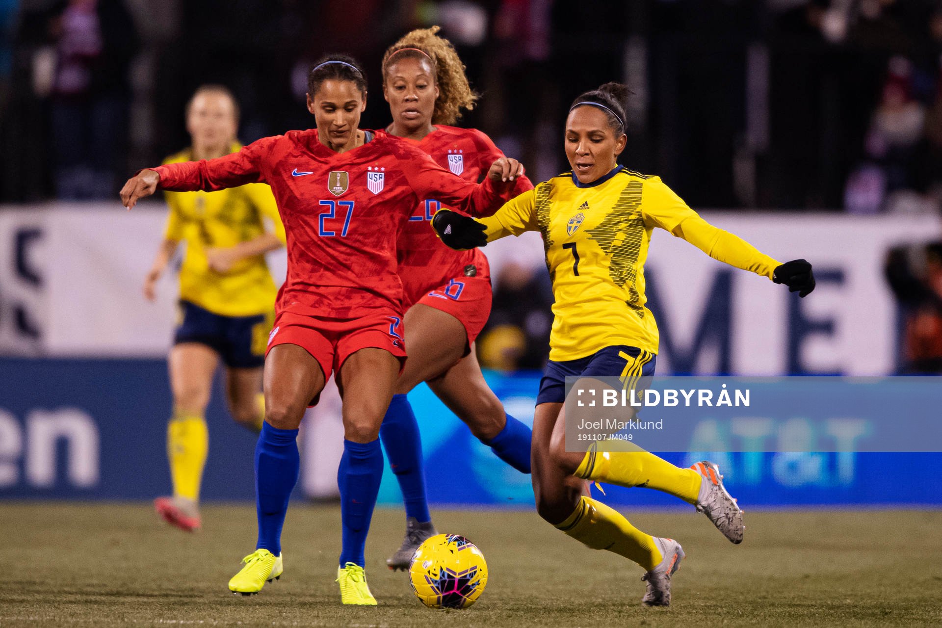 Lynn Williams and Allie Long of USA in action against