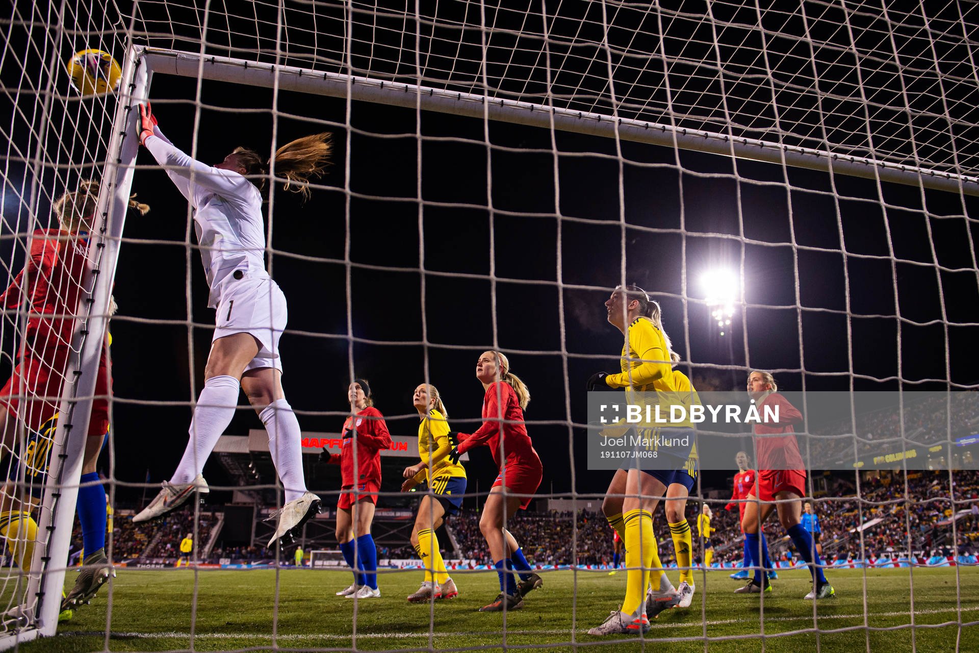Goalkeeper Alyssa Naeher of USA saves the ball in front of