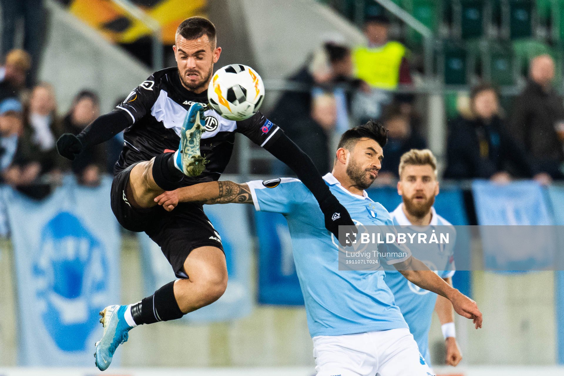 Filip Holender of Lugano and Behrang Safari of Malmö FF