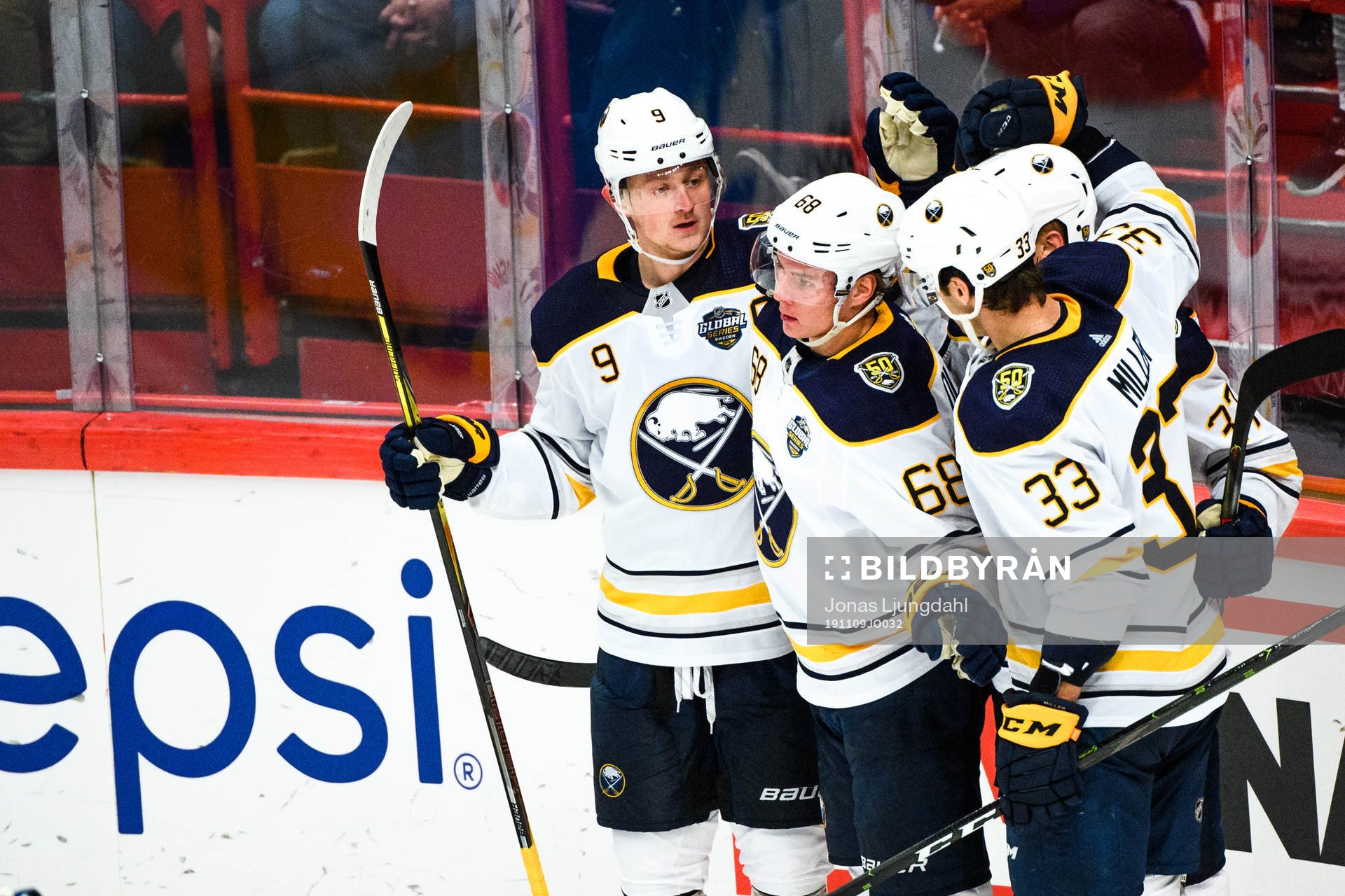 Jack Eichel, Victor Olofsson and Colin Miller of Buffalo