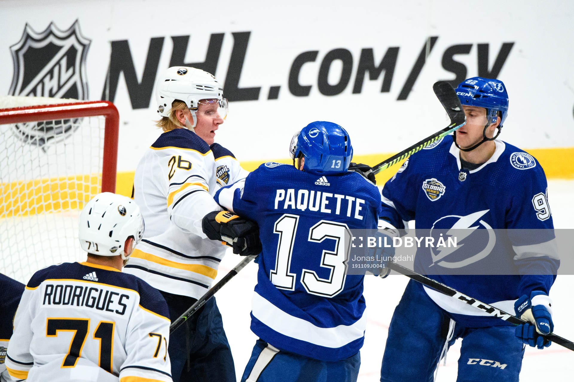 Rasmus Dahlin of Buffalo Sabres fights Cédric Paquette of
