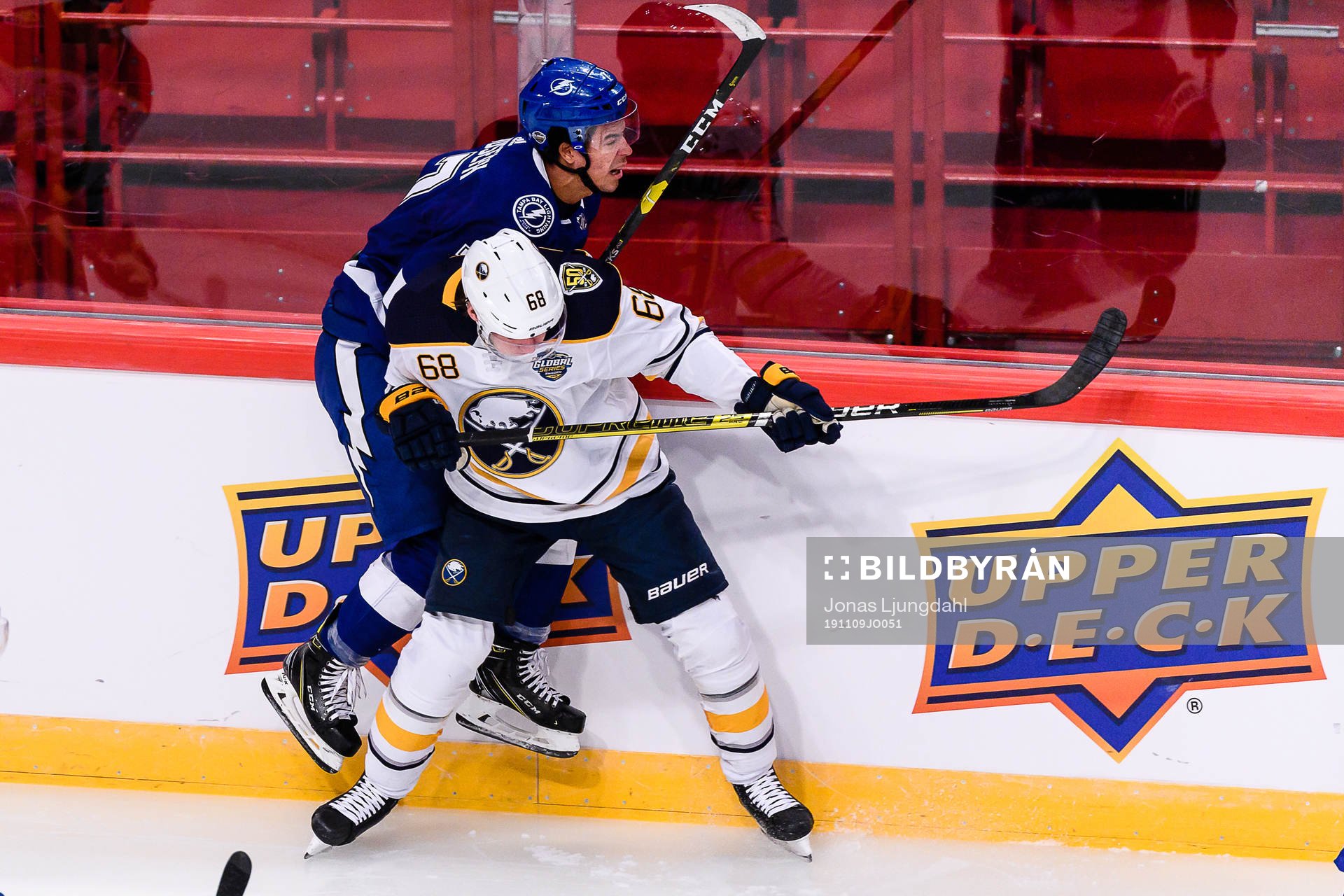 Victor Olofsson of Buffalo Sabres hits Mathieu Joseph of