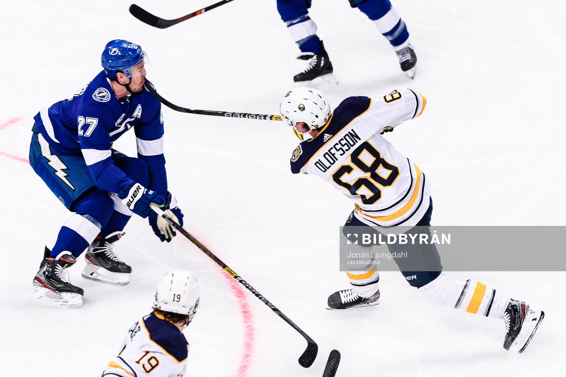 Victor Olofsson of Buffalo Sabres stick hits Ryan McDonagh