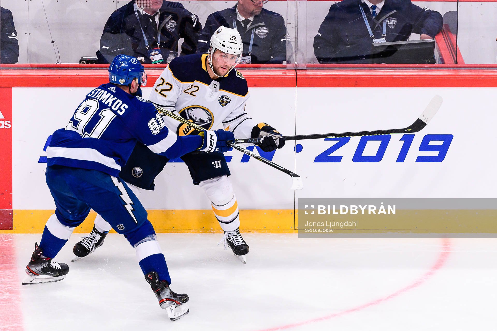 Johan Larsson of Buffalo Sabres gets hit by Steven Stamkos