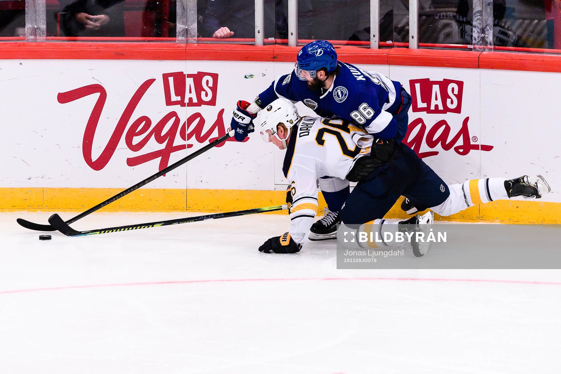 Rasmus Dahlin goes down in a battle with Nikita Kucherov of