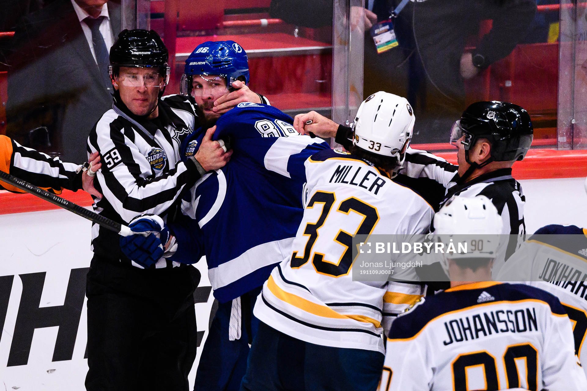 Nikita Kucherov of Tampa Bay Lightning fights Colin Miller