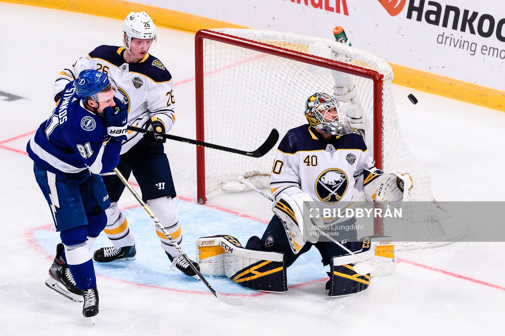 Steven Stamkos gets hit by Rasmus Dahlin of Buffalo Sabres
