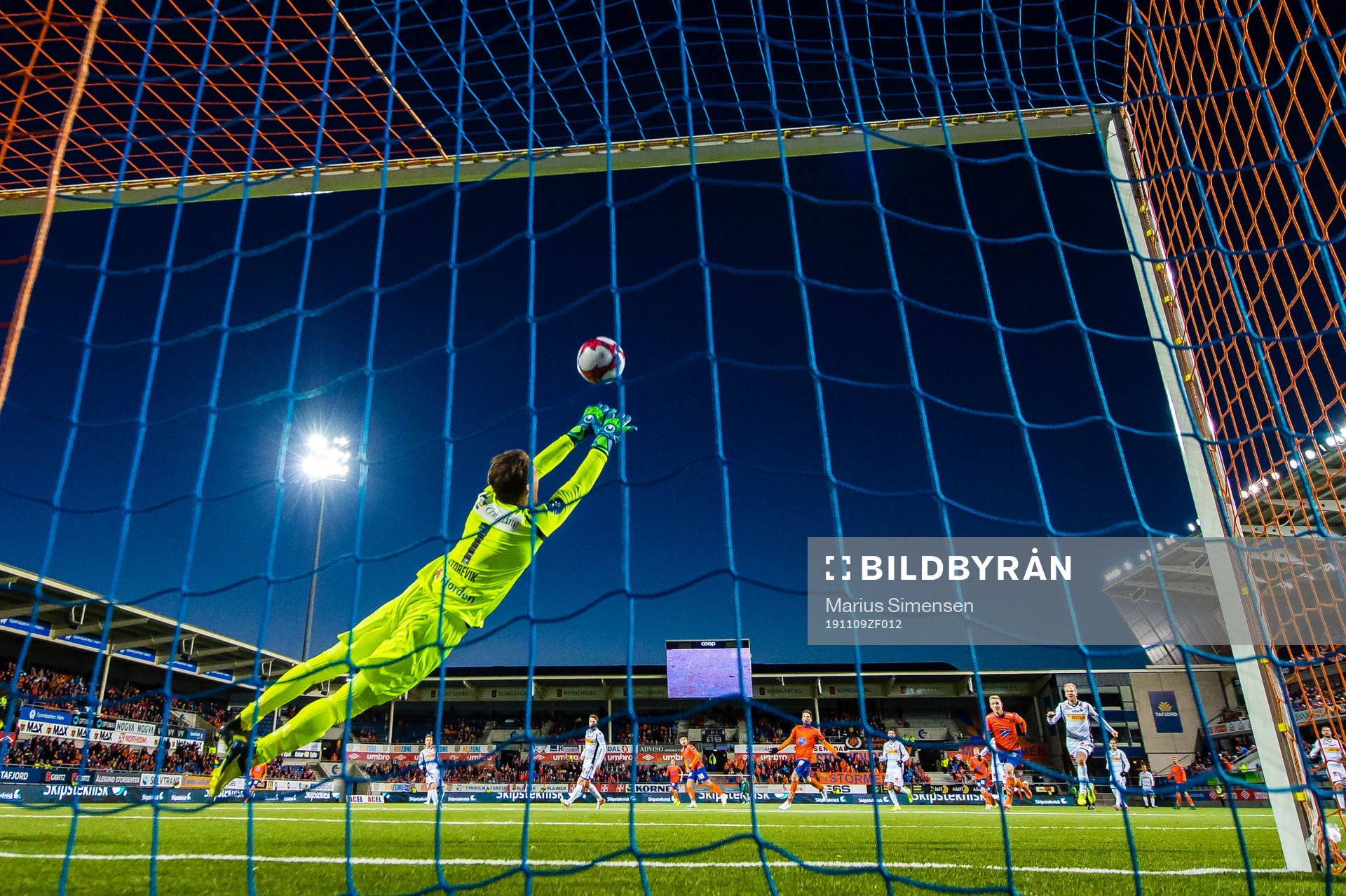 Niklas Fernando Nygaard Castro of Aalesund scores the 2-1 goal on Jacob Storevik of Sandefjord during the OBOS-ligaen match between Aalesund and Sandefjord on November 9, 2019 in Ålesund.
