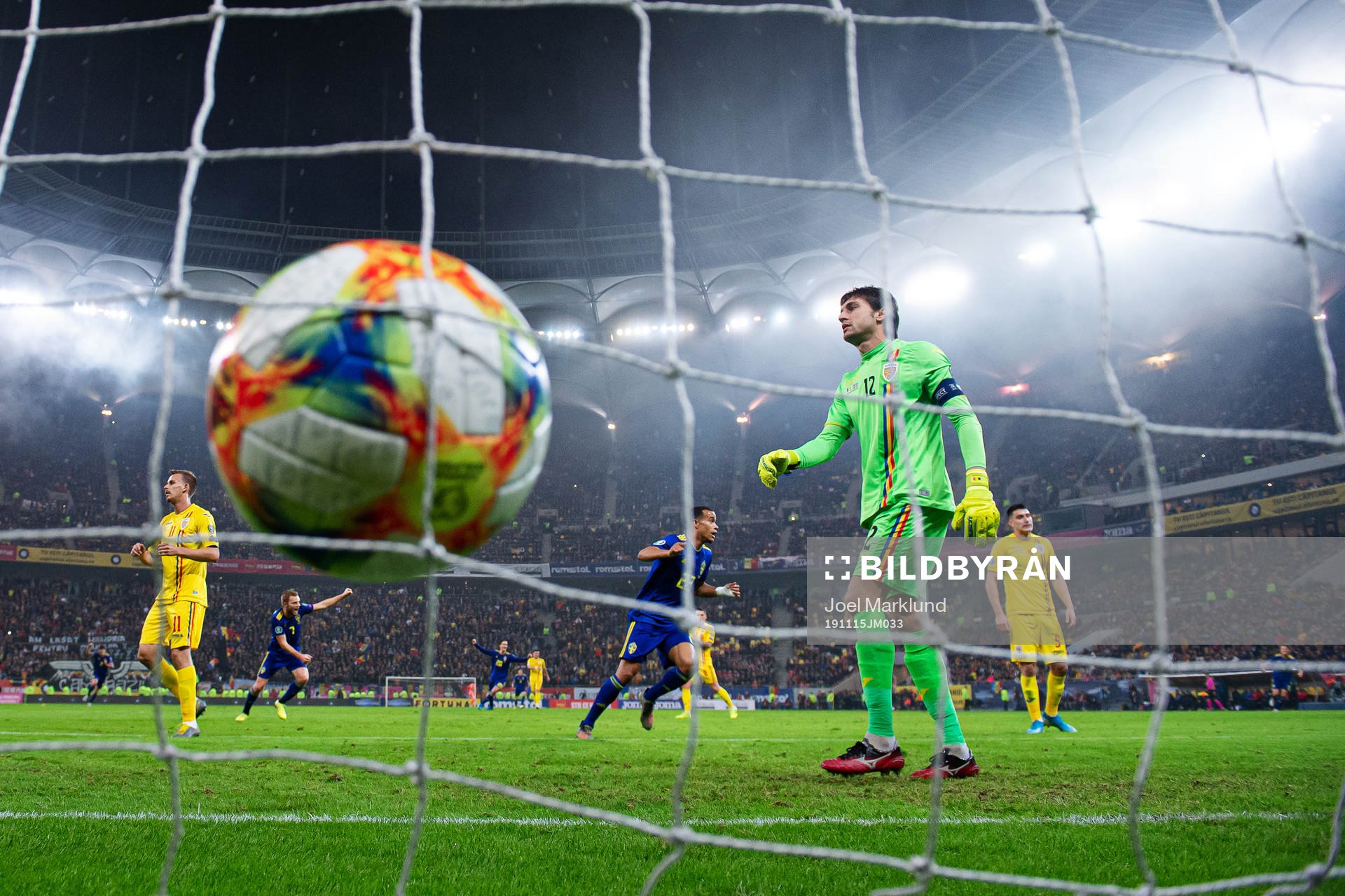 Robin Quaison of Sweden celebrates while goalkeeper Ciprian