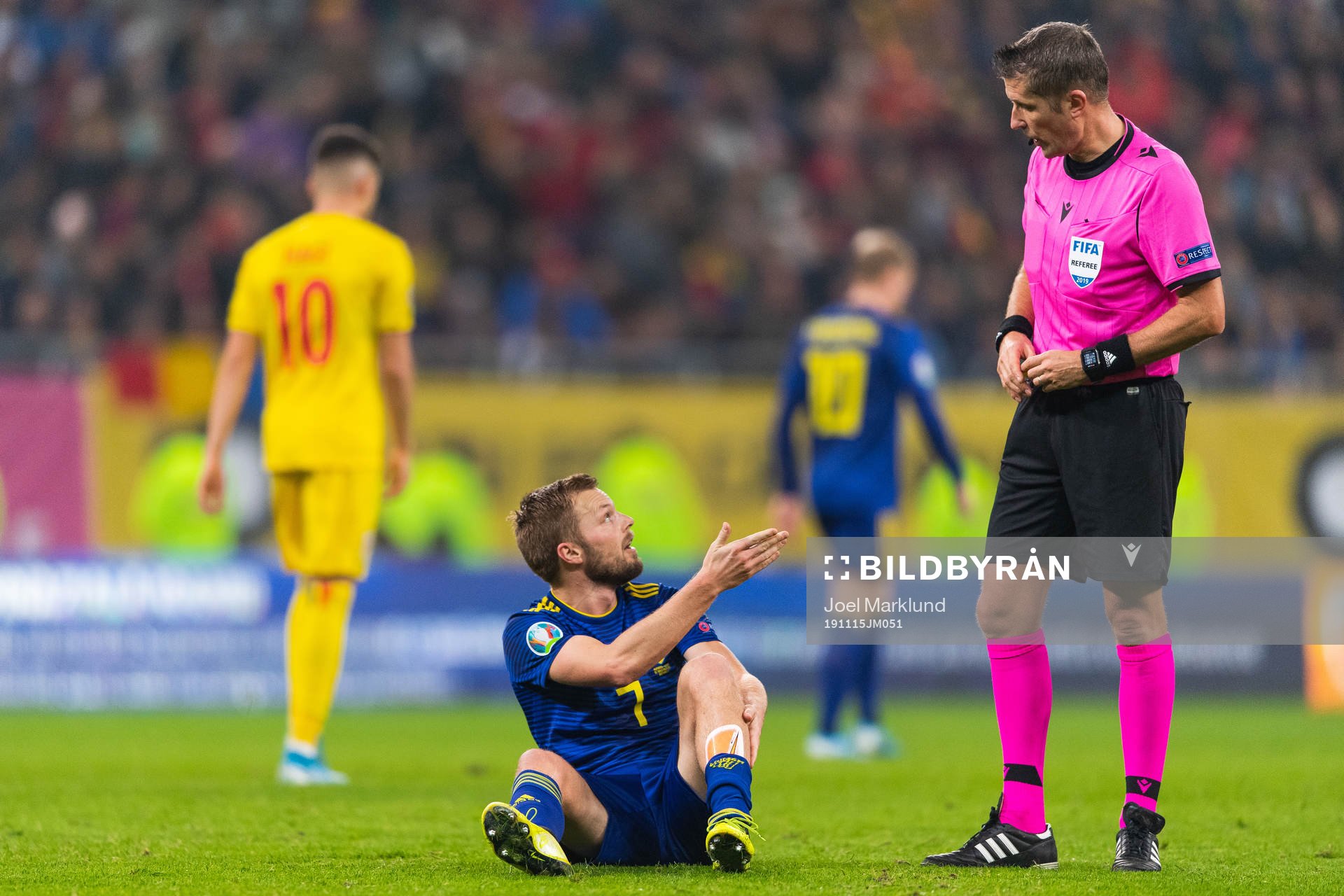 Sebastian Larsson of Sweden reacts against referee Daniele