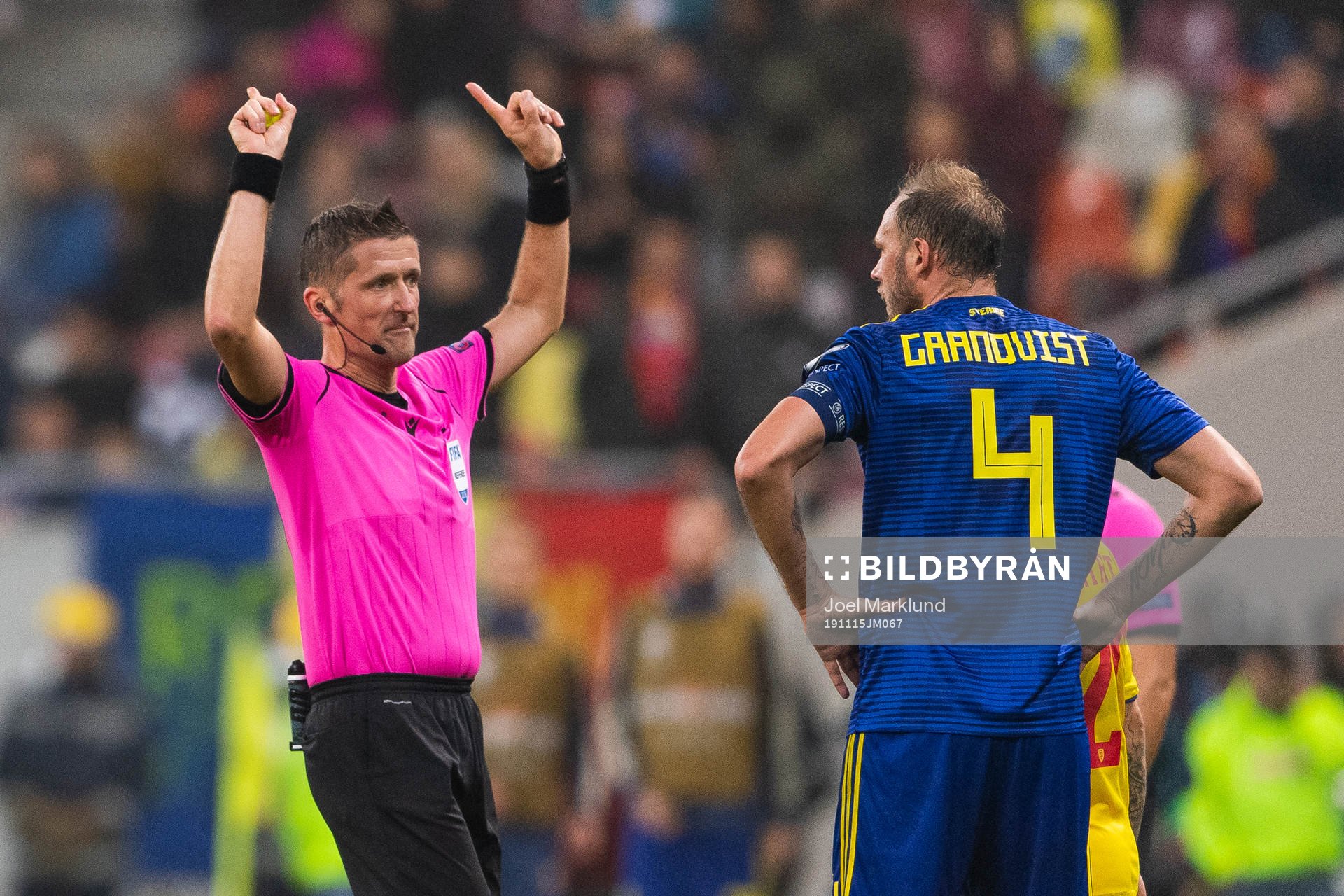 Referee Daniele Orsato in a discussion with Andreas