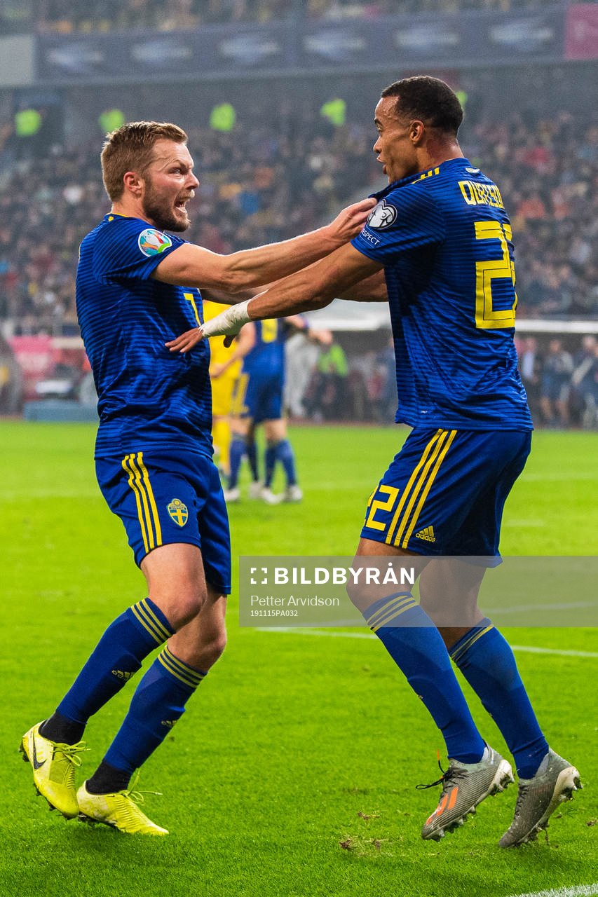Sebastian Larsson and Robin Quaison of Sweden celebrate 0-2
