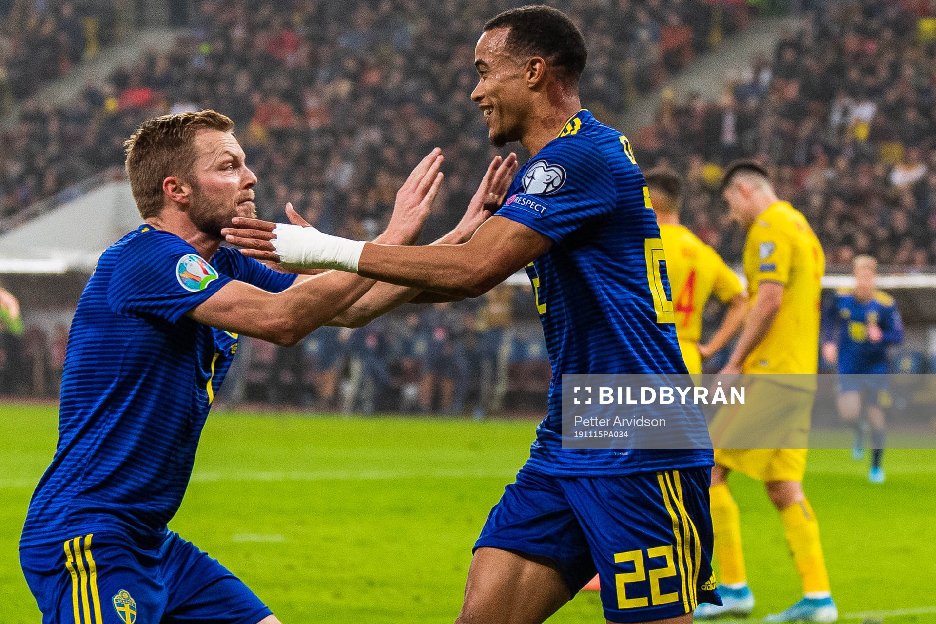 Sebastian Larsson and Robin Quaison of Sweden celebrate 0-2