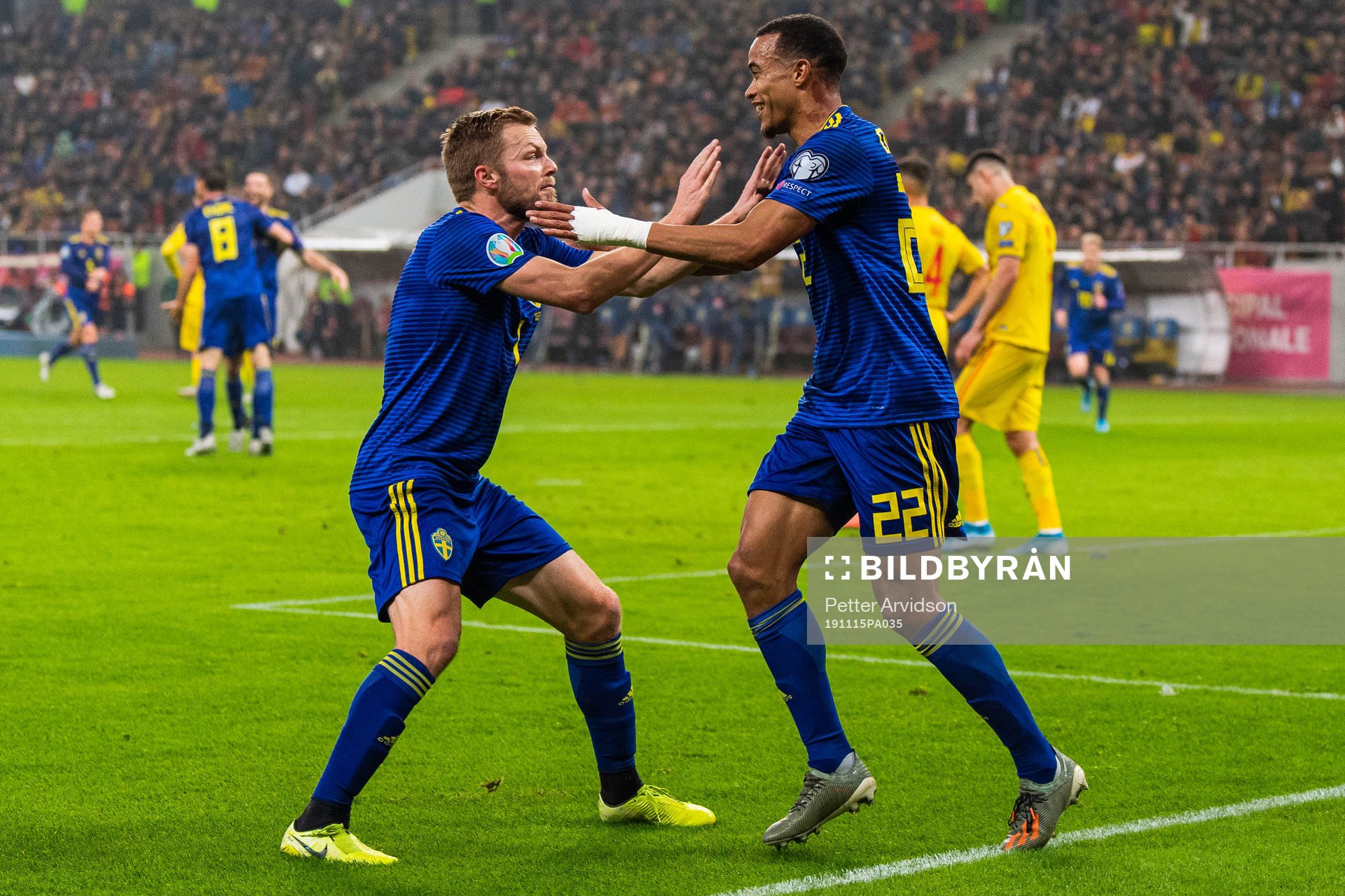 Sebastian Larsson and Robin Quaison of Sweden celebrate 0-2