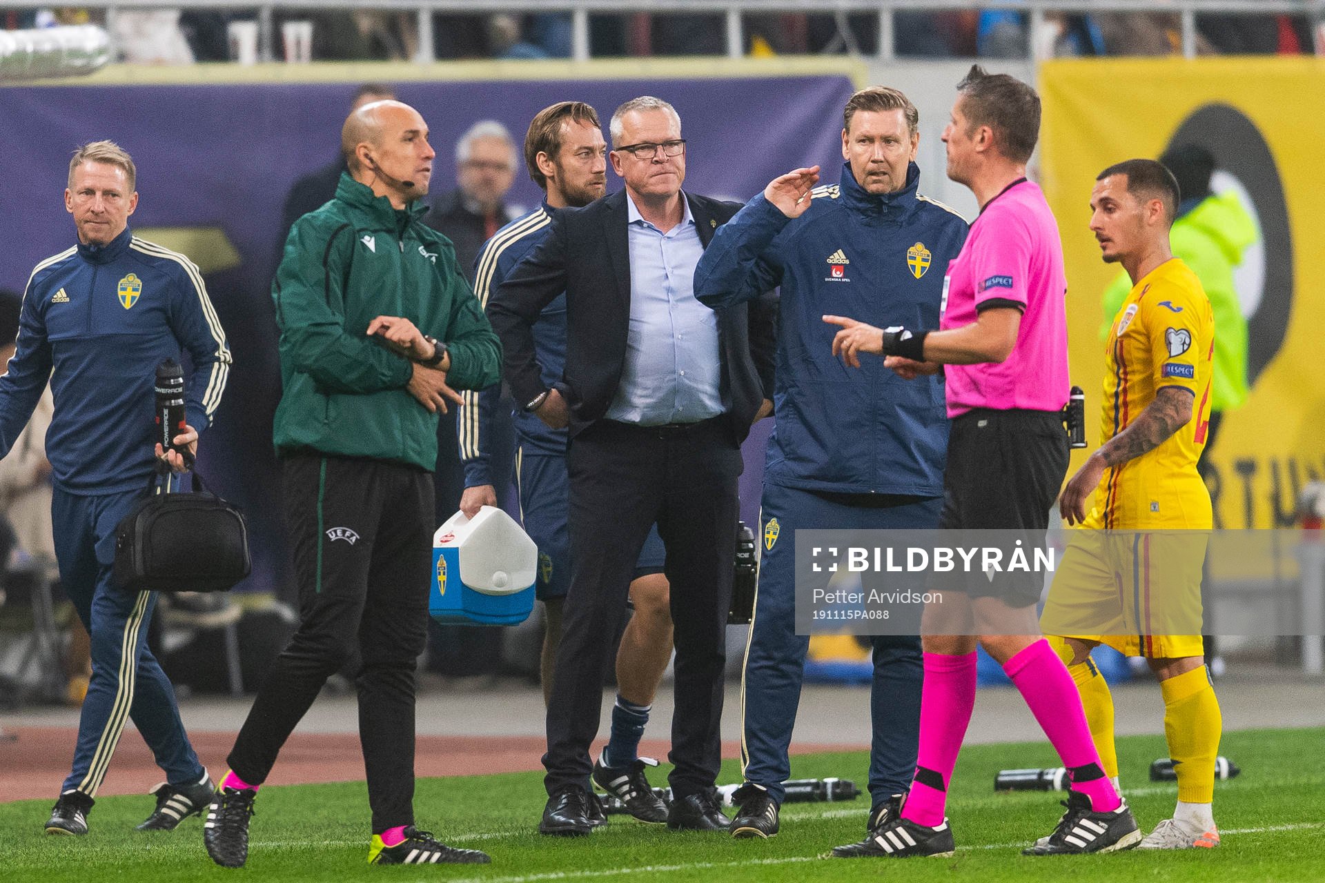 Fourth official Michael Fabri and referee Daniele Orsato in