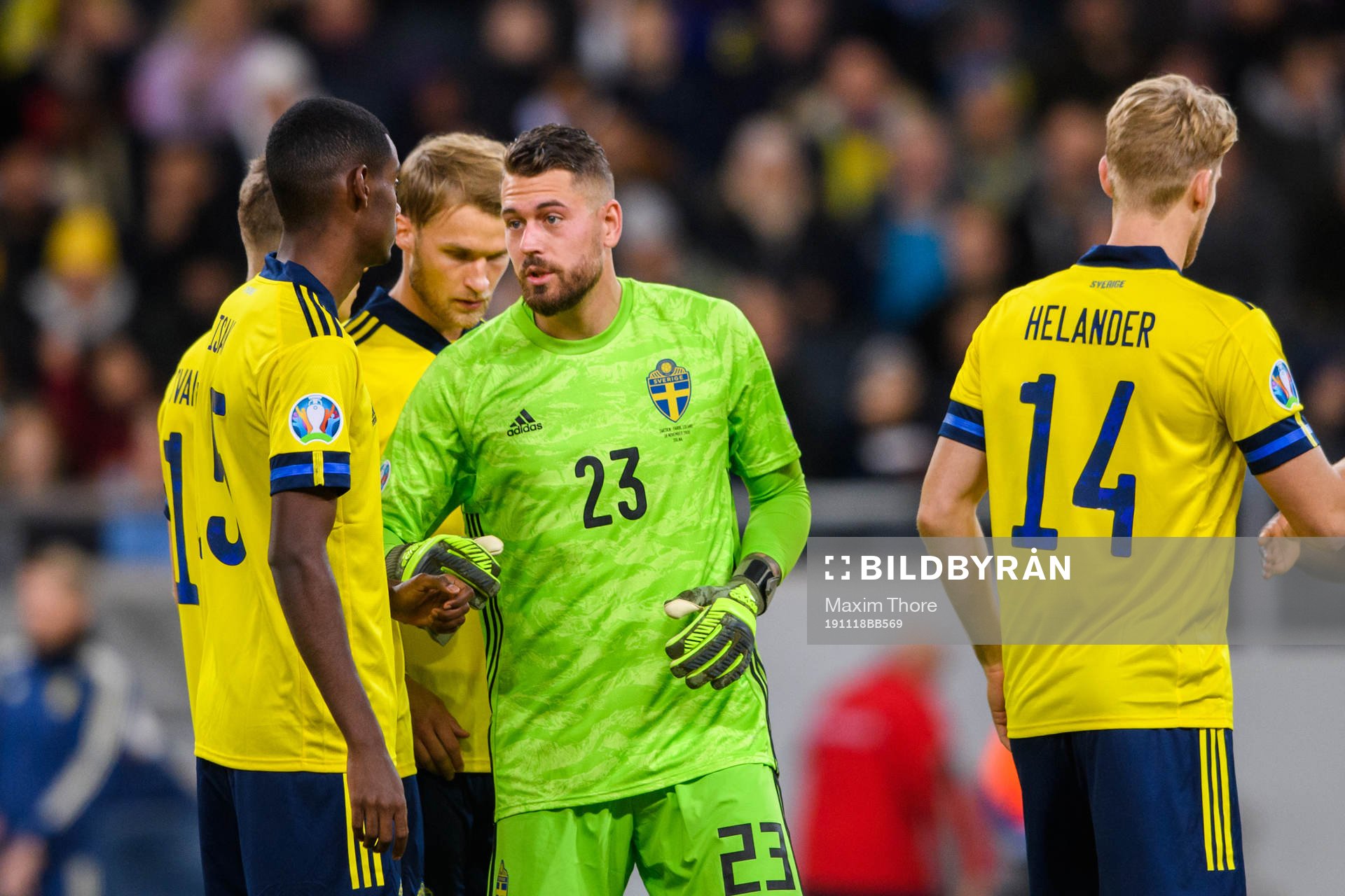 goalkeeper Kristoffer Nordfeldt and Alexander Isak of Sweden