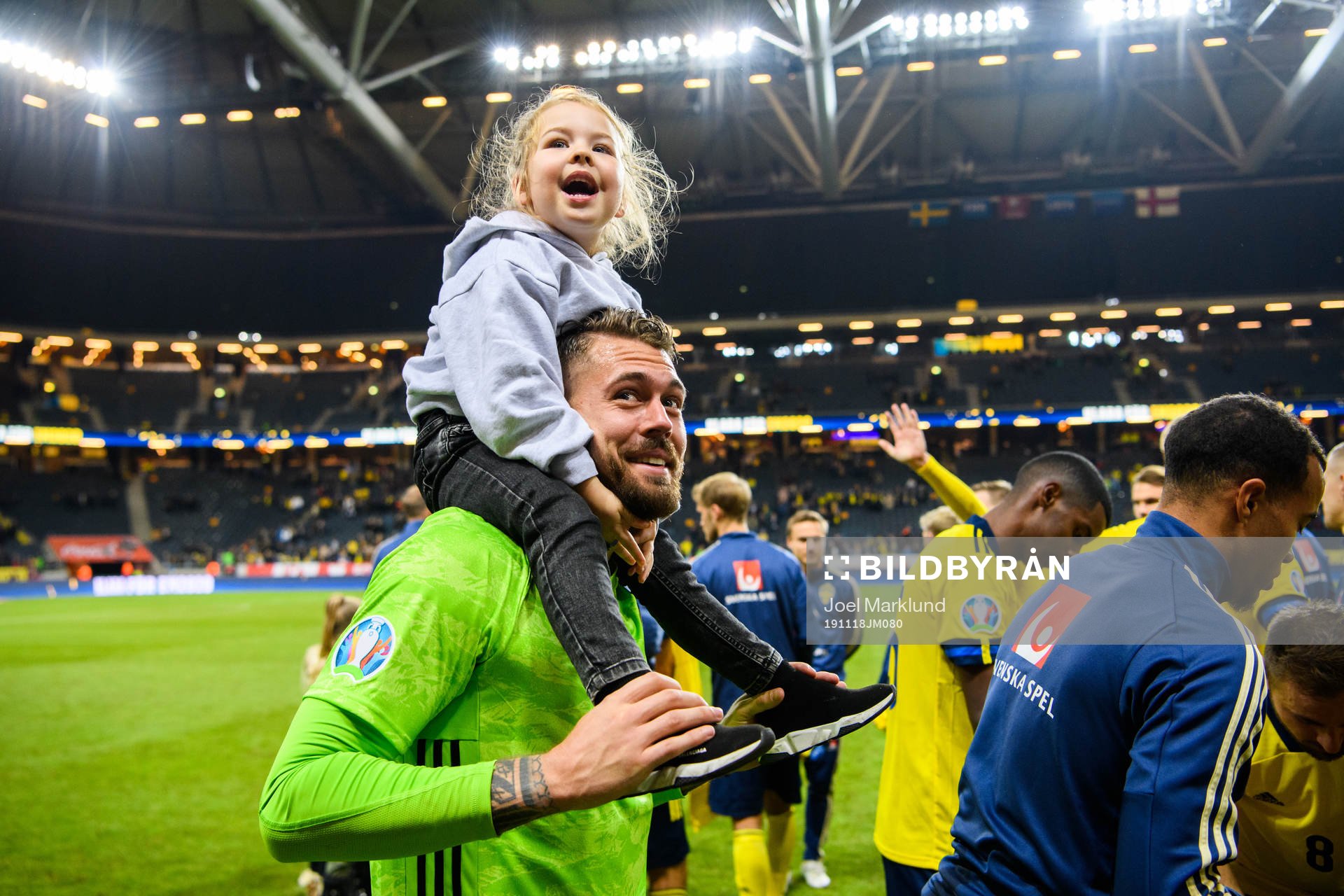 Goalkeeper Kristoffer Nordfeldt of Sweden with his daughter
