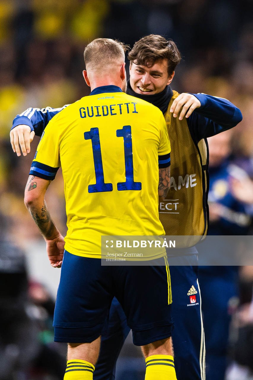 John Guidetti of Sweden celebrates scoring 3-0 and hugs