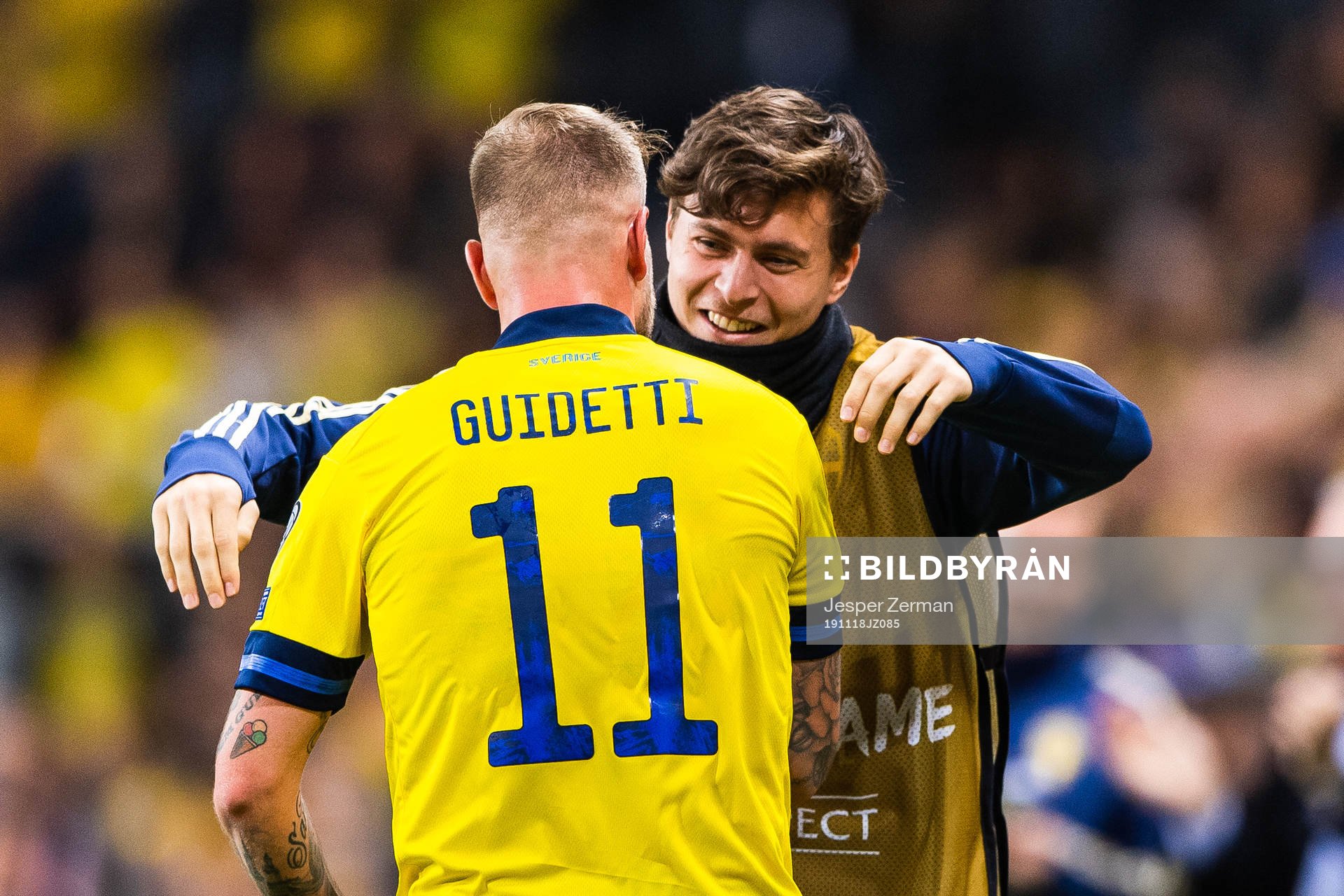 John Guidetti of Sweden celebrates scoring 3-0 and hugs