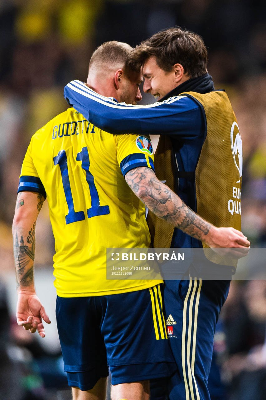 John Guidetti of Sweden celebrates scoring 3-0 and hugs