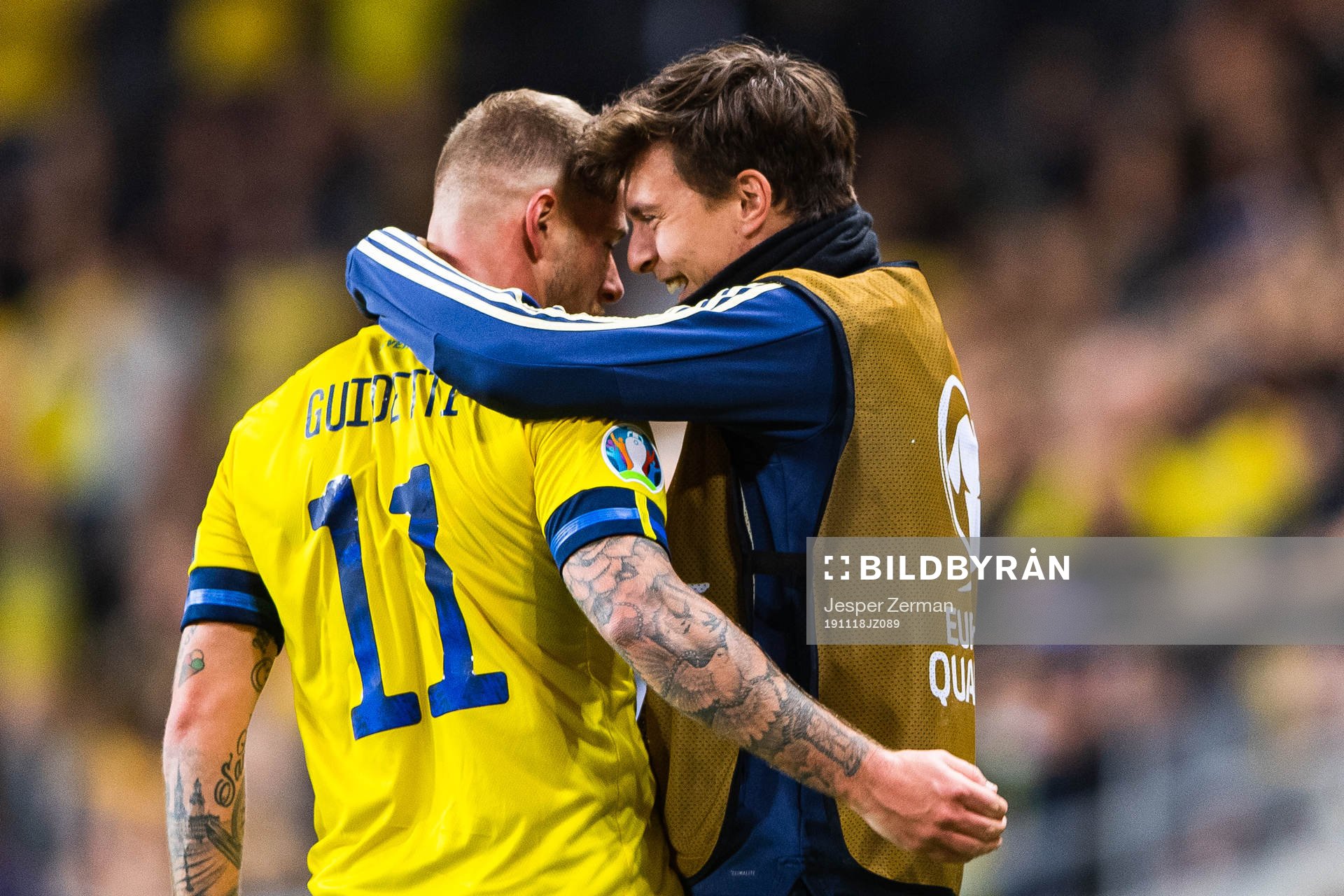 John Guidetti of Sweden celebrates scoring 3-0 and hugs