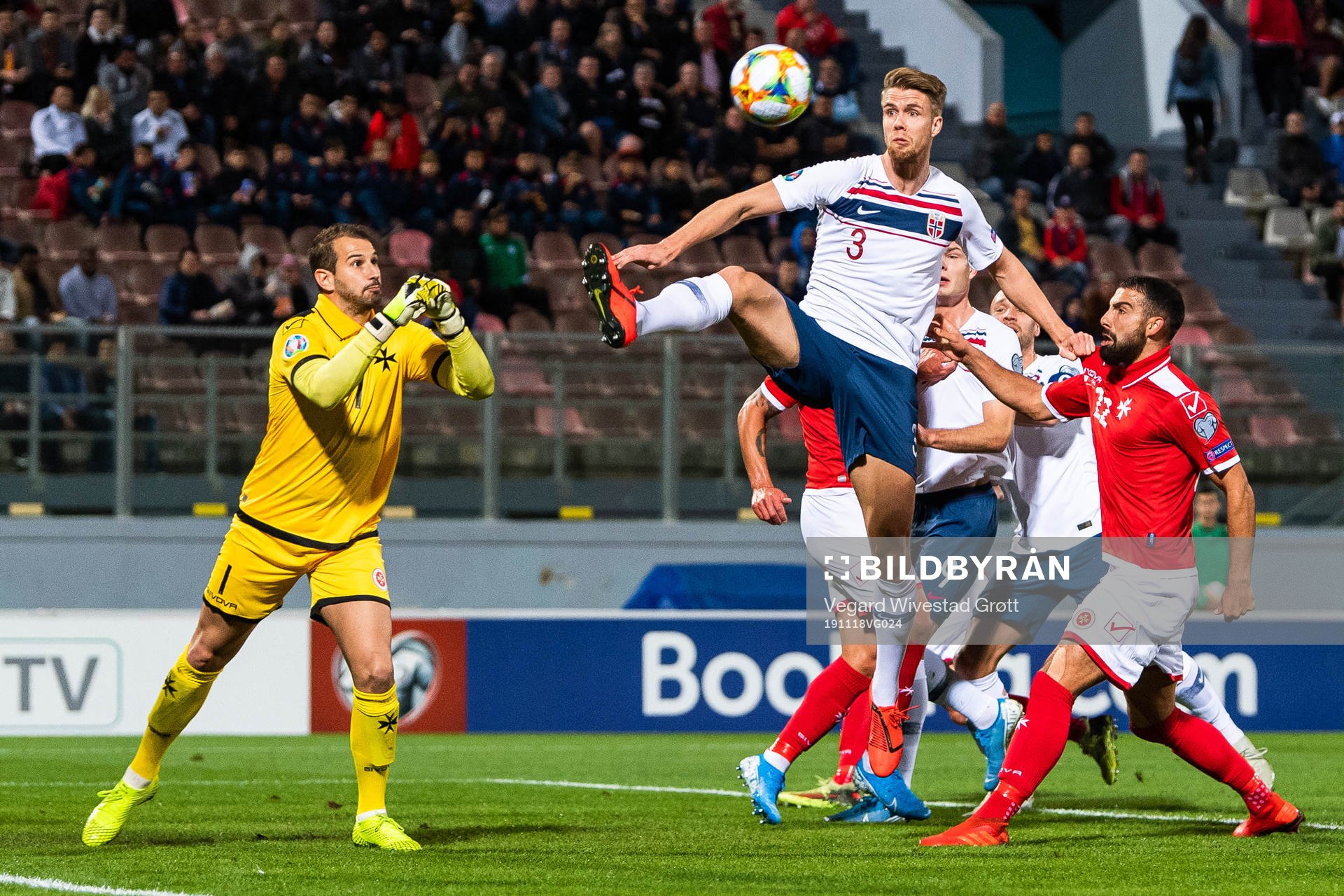Goalkeeper Henry Bonello of Malta and Kristoffer Ajer of